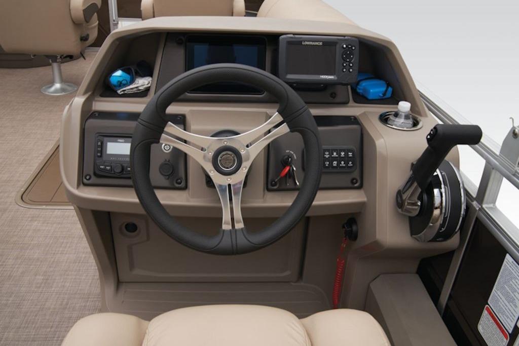 2025 Sun Tracker Sportfish™ 24 XP3 helm with steering wheel and control panel.
