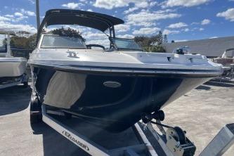 2024 Sea Ray SPX 230 boat on trailer under blue sky.