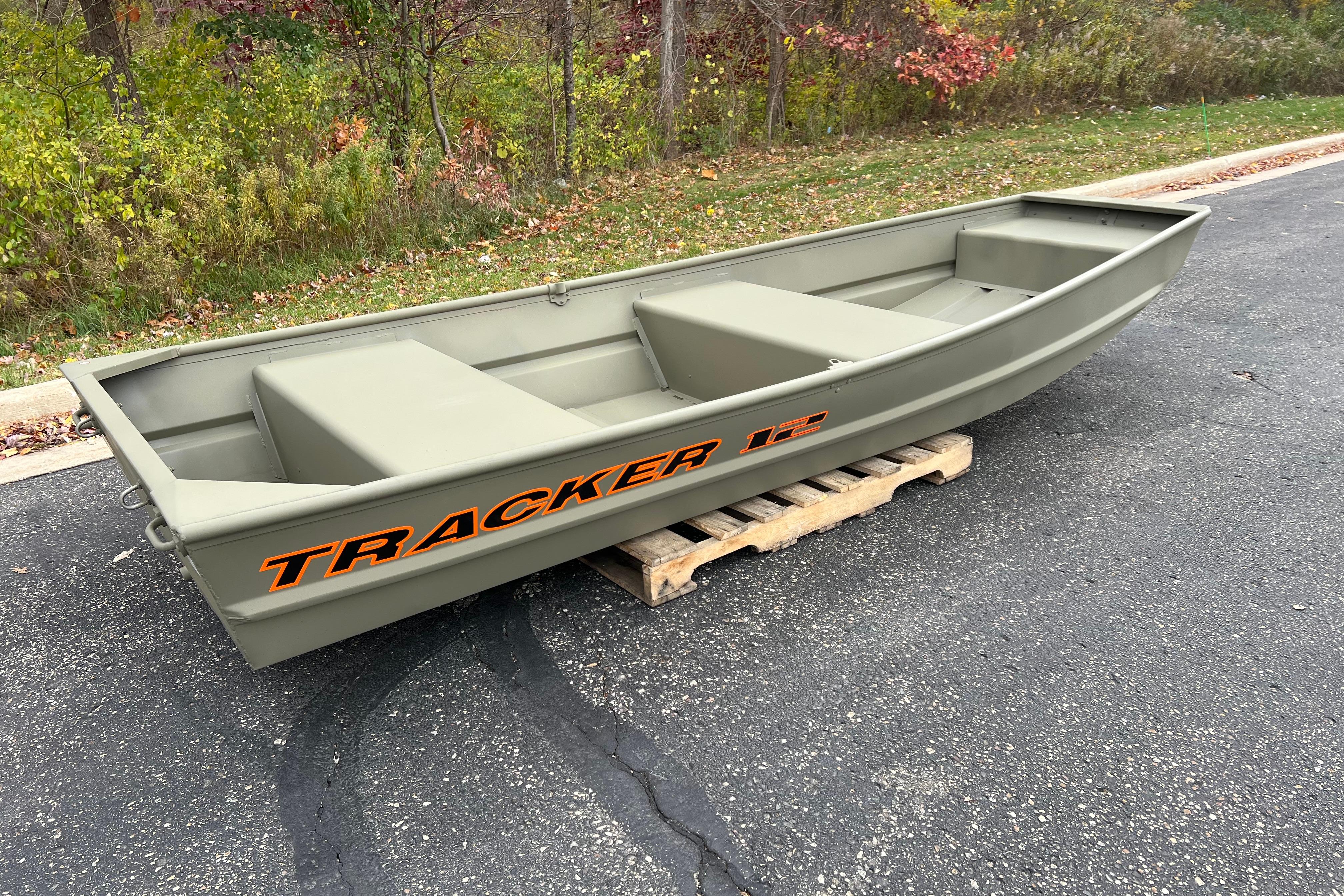 2026 Tracker Grizzly 12 Jon boat on a wooden pallet, outdoors.