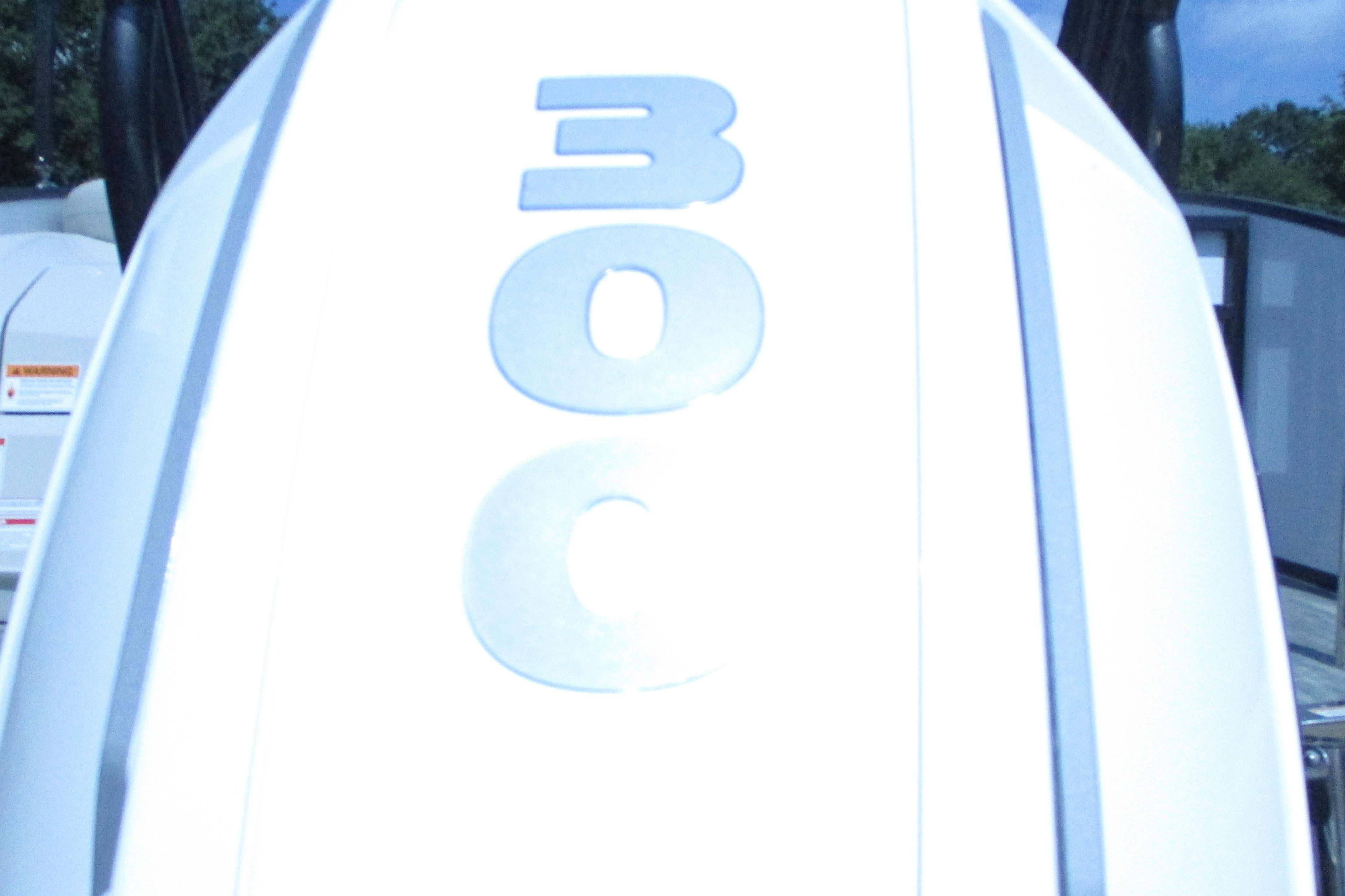 Close-up of 2021 Crest Caribbean LX 250 SLS boat engine with '300C' marking.
