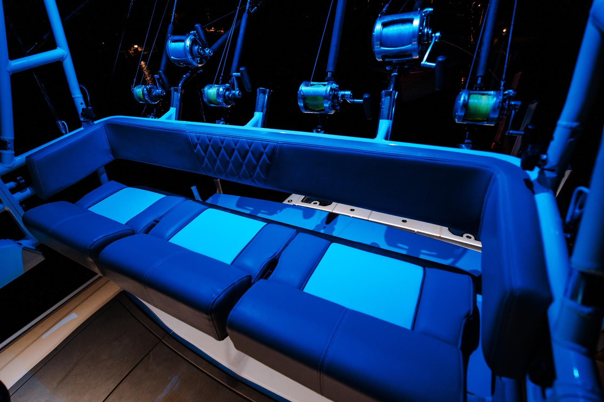 2026 Everglades 455 Center Console boat with illuminated seating and fishing rods.