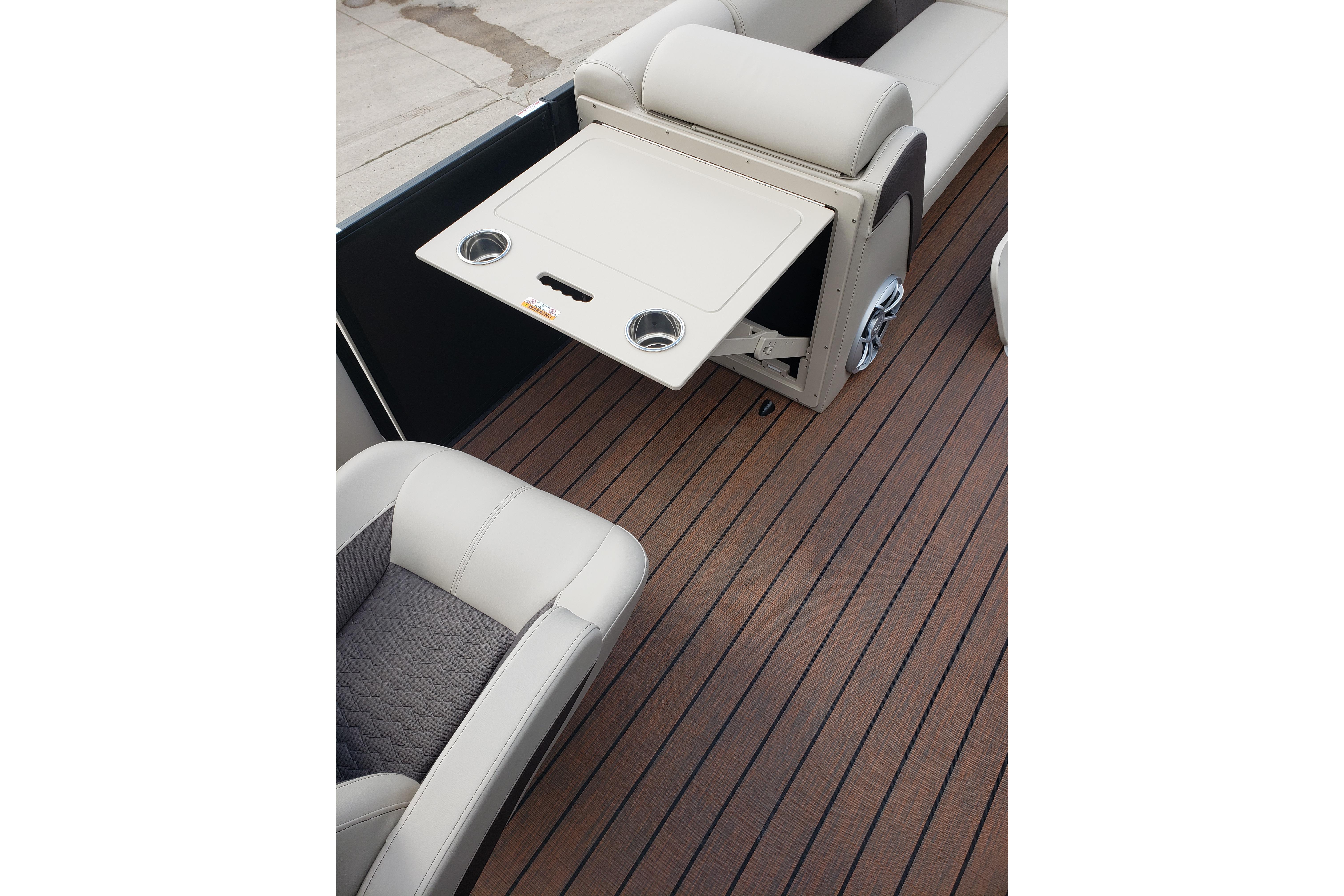 2026 Bentley Pontoons Elite 253 QSB interior with foldable table and cup holders.