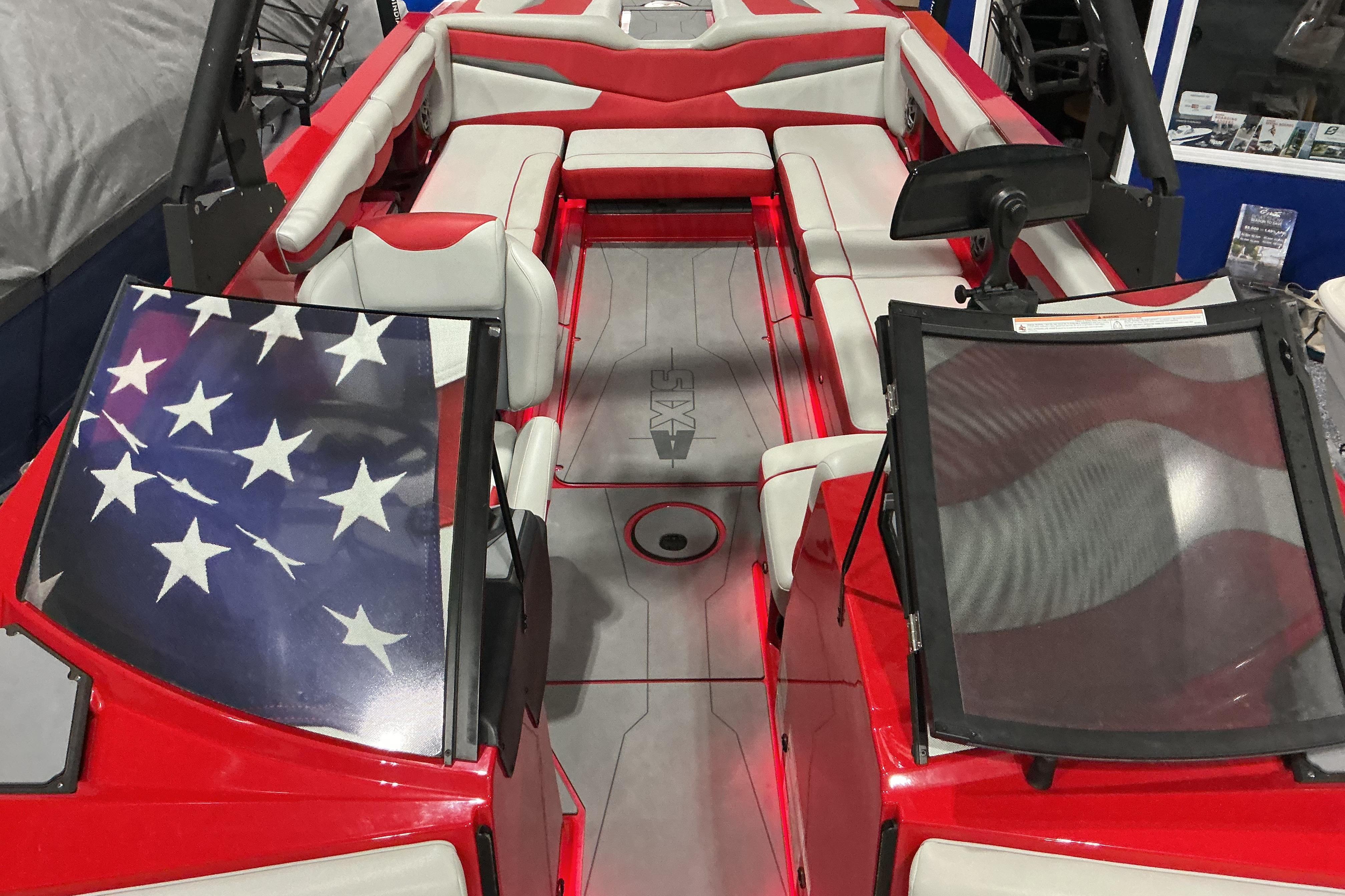 Red and white 2022 Axis T250 boat interior with American flag design on windshield.