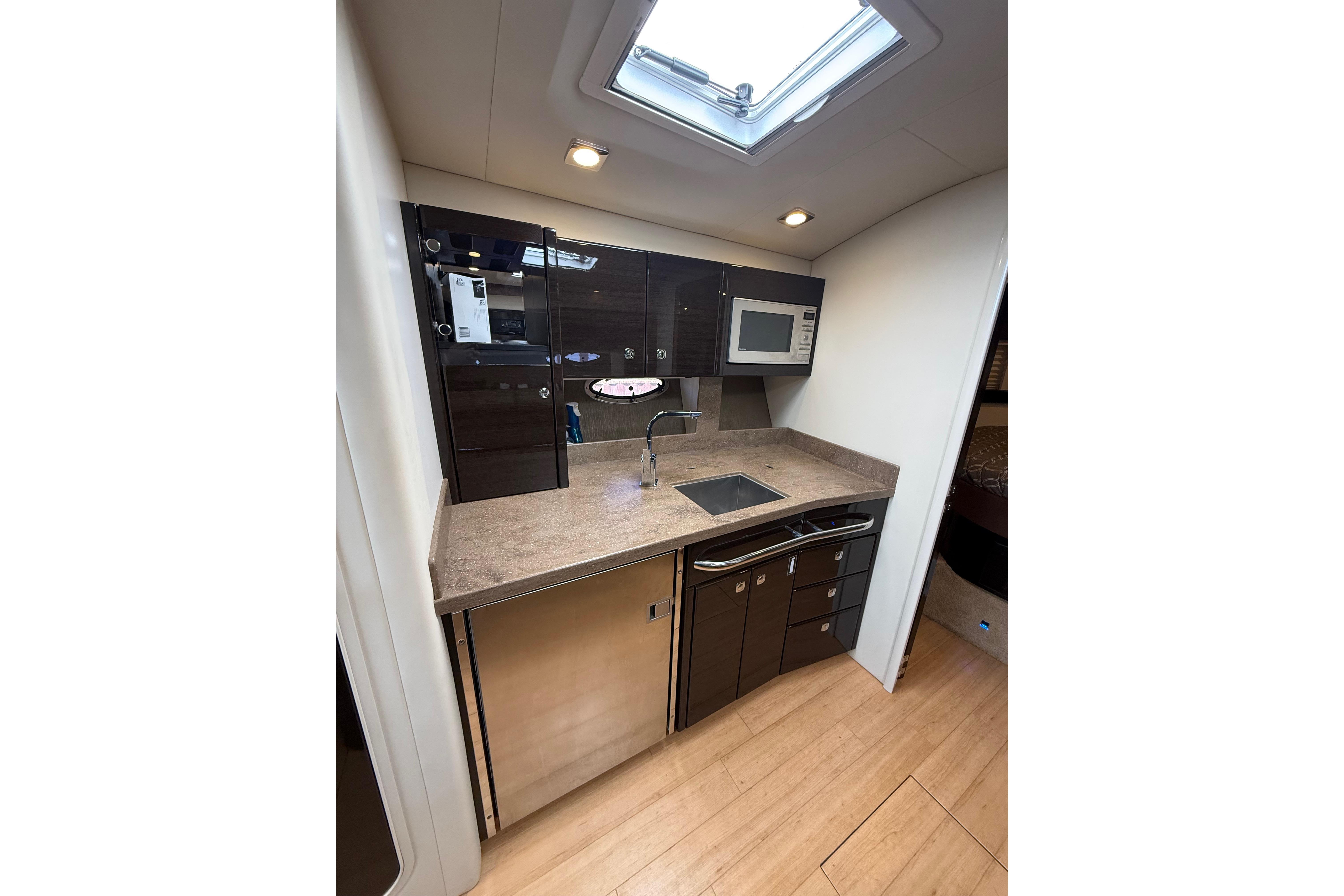 2014 Formula 37 Performance Cruiser kitchen with modern appliances and sleek cabinetry.