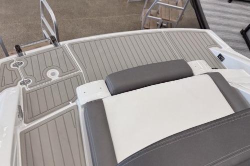 2026 Crownline Eclipse E255 boat deck with gray and white seating.