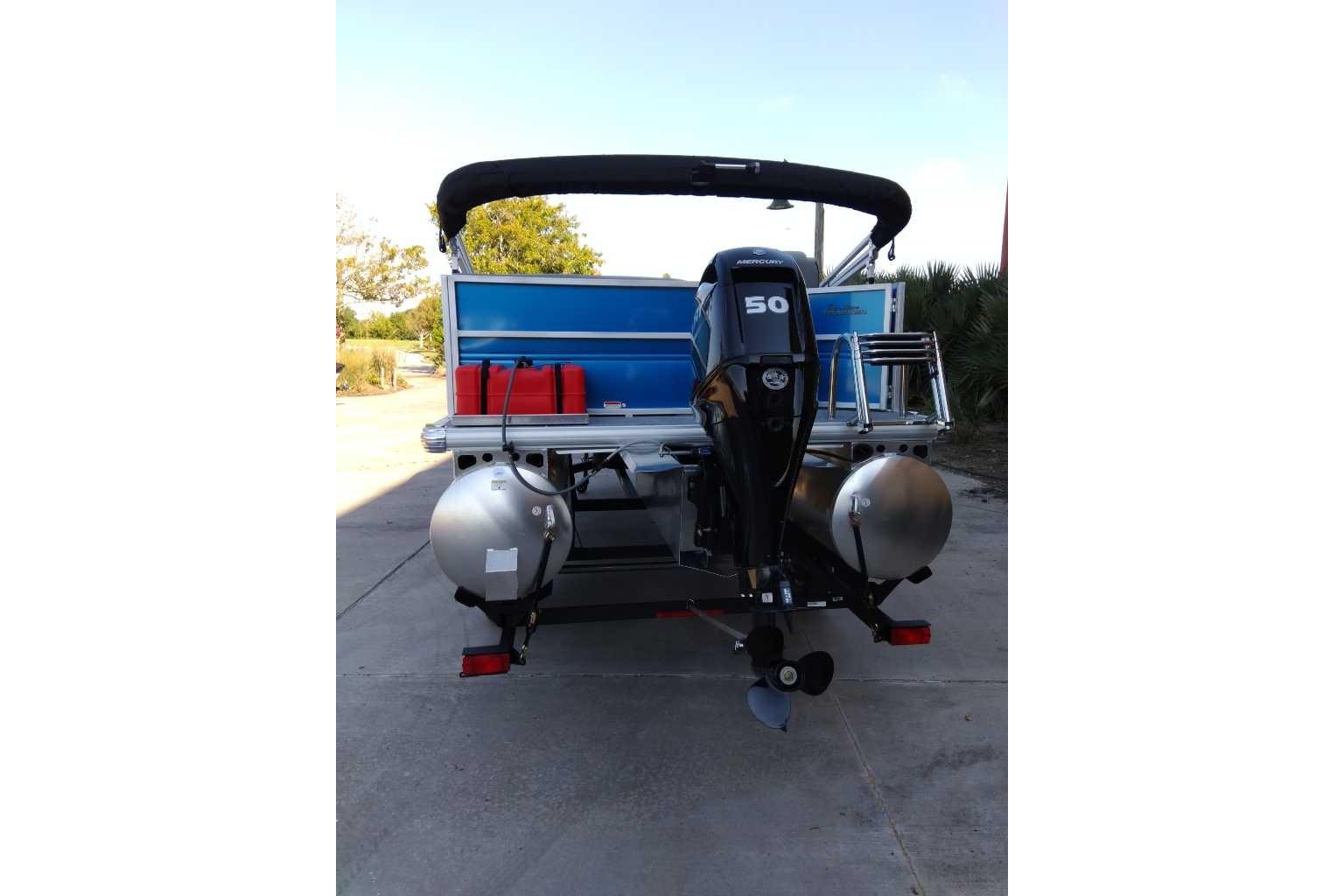 2026 Sun Tracker Party Barge 16 DLX pontoon boat with Mercury 50 HP outboard motor.