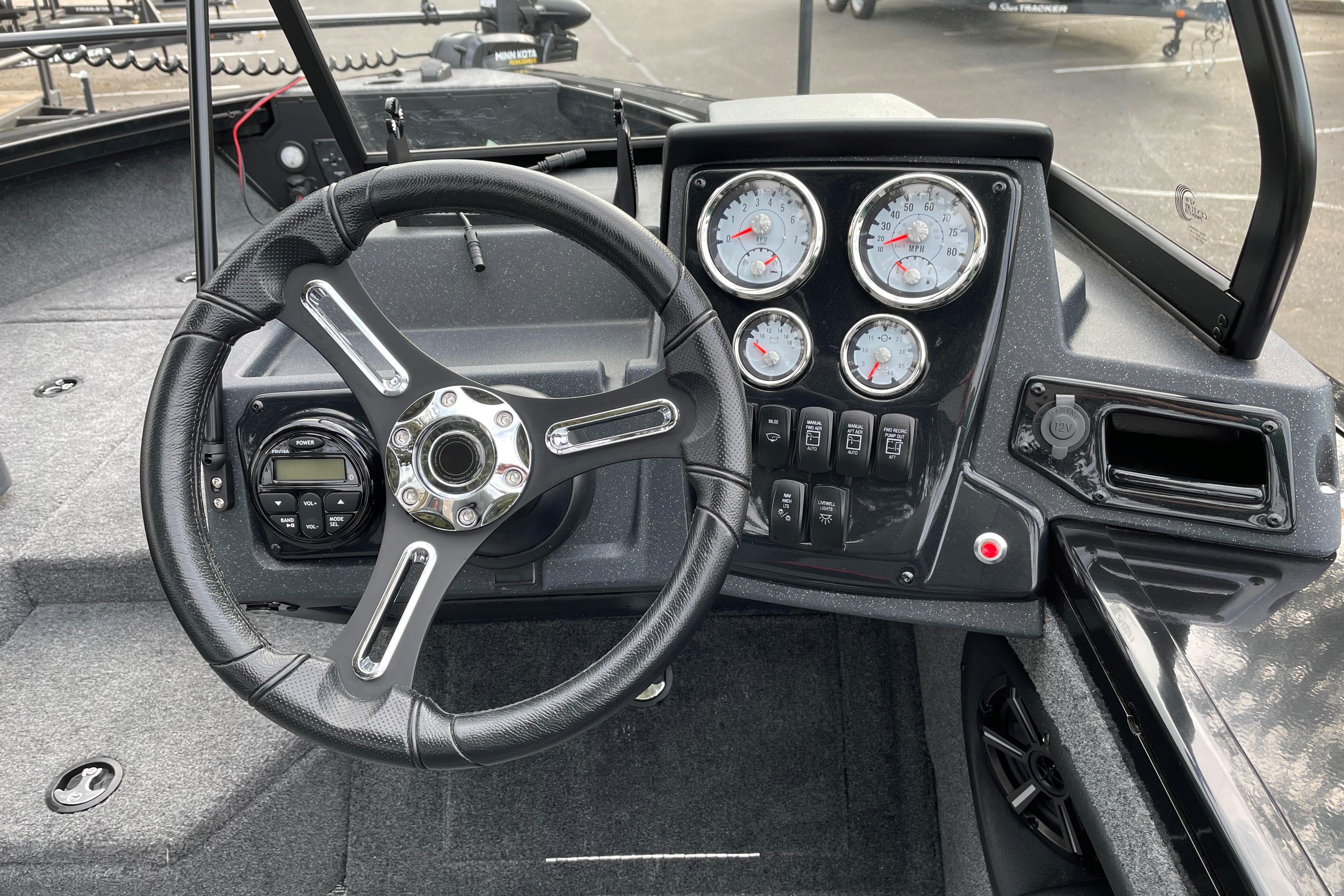 2026 Tracker Targa V-19 WT boat dashboard with steering wheel and gauges.