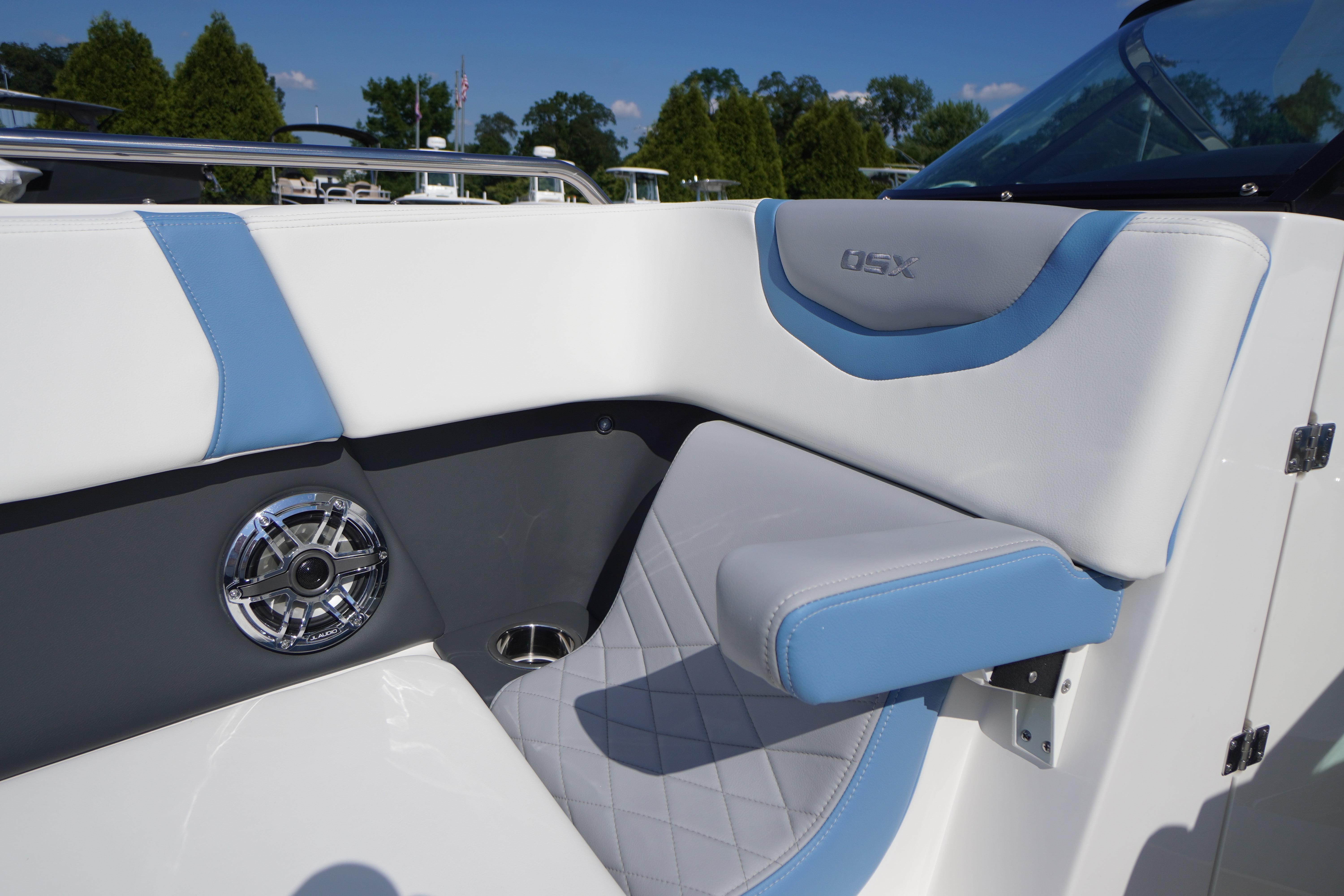 Interior seating of 2026 Chaparral 270 OSX boat with blue and white upholstery.