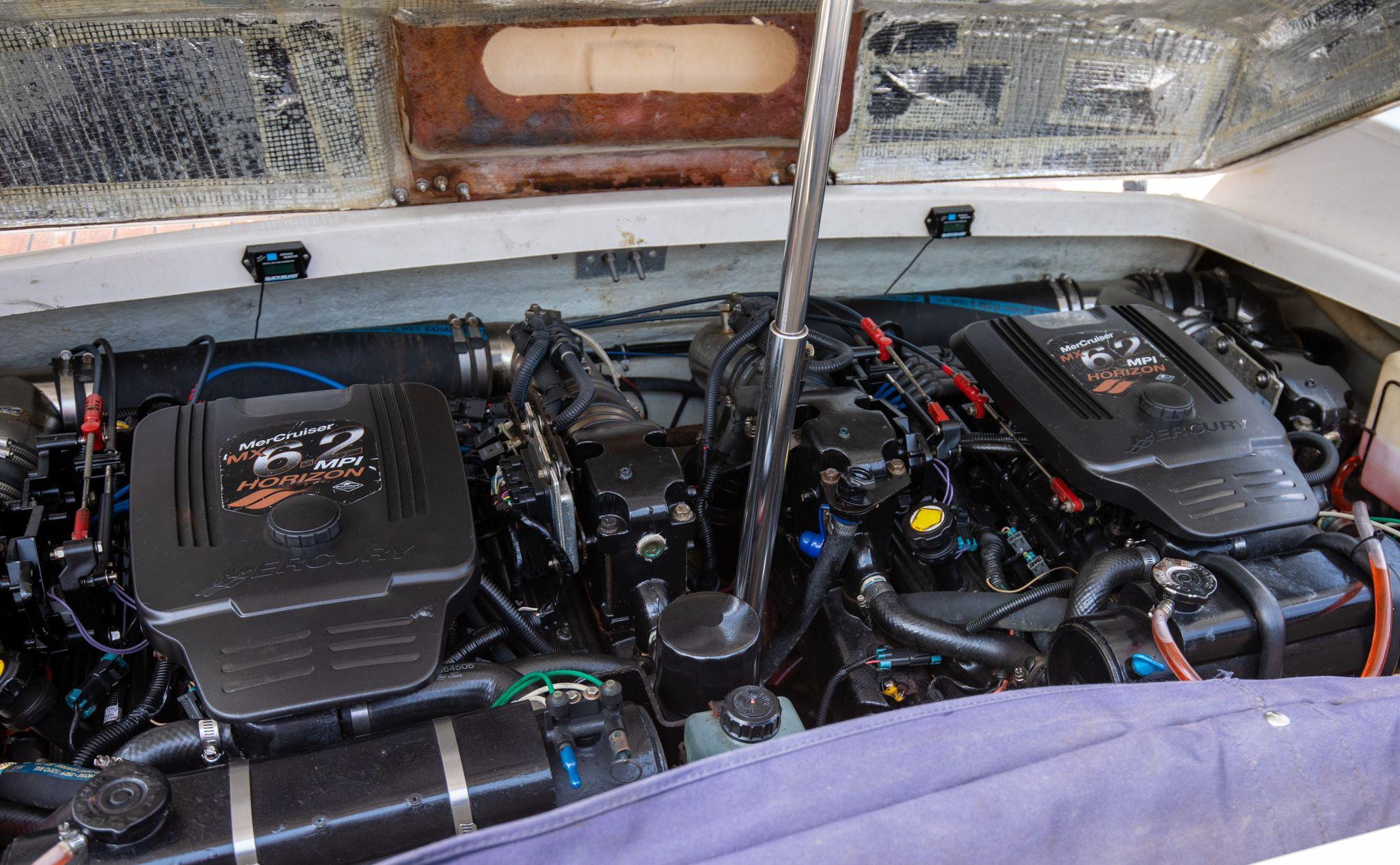 2004 Chris-Craft Corsair 28 engine compartment with twin MerCruiser engines.