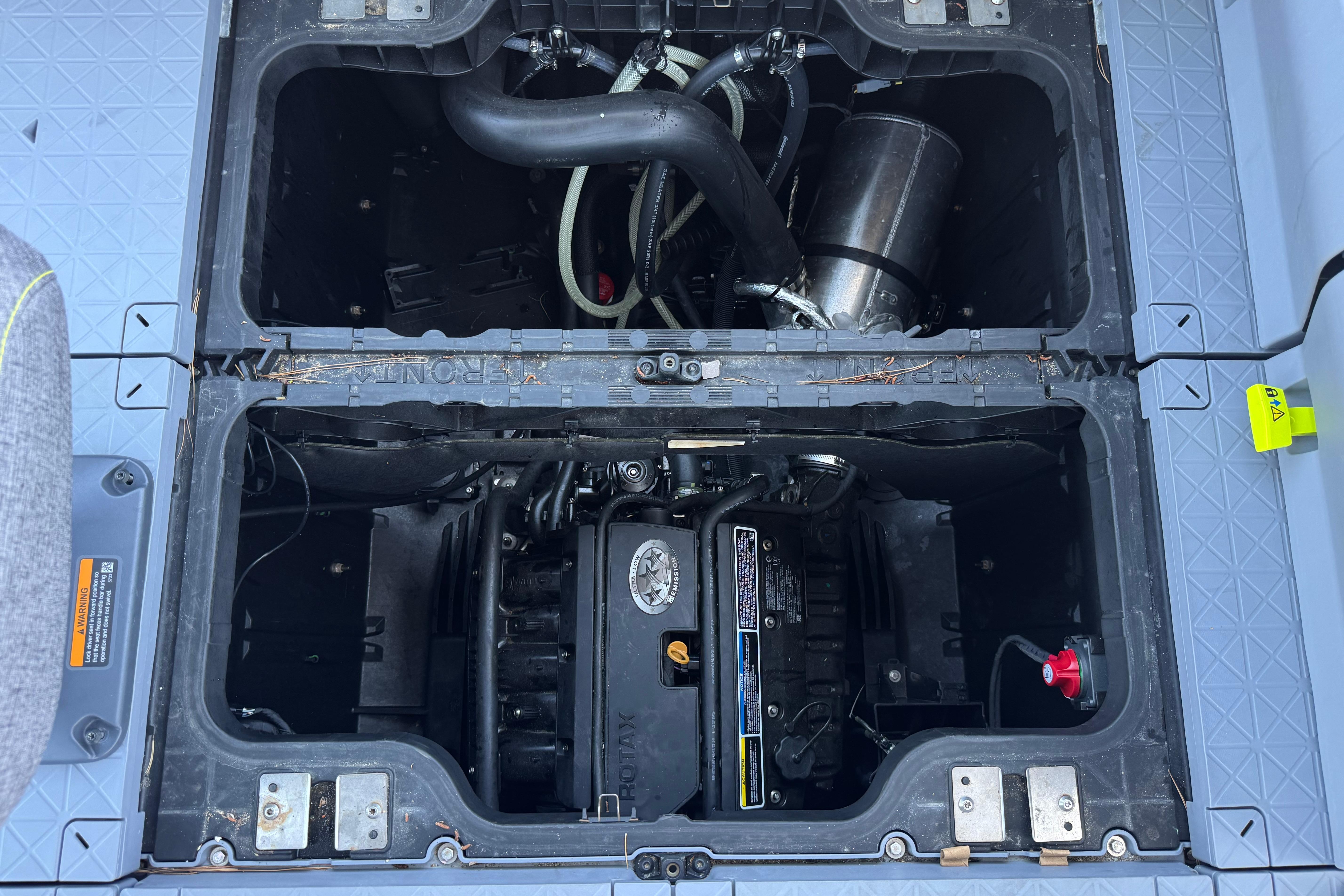Engine compartment of 2024 Sea-Doo Switch Compact, showcasing internal components and layout.