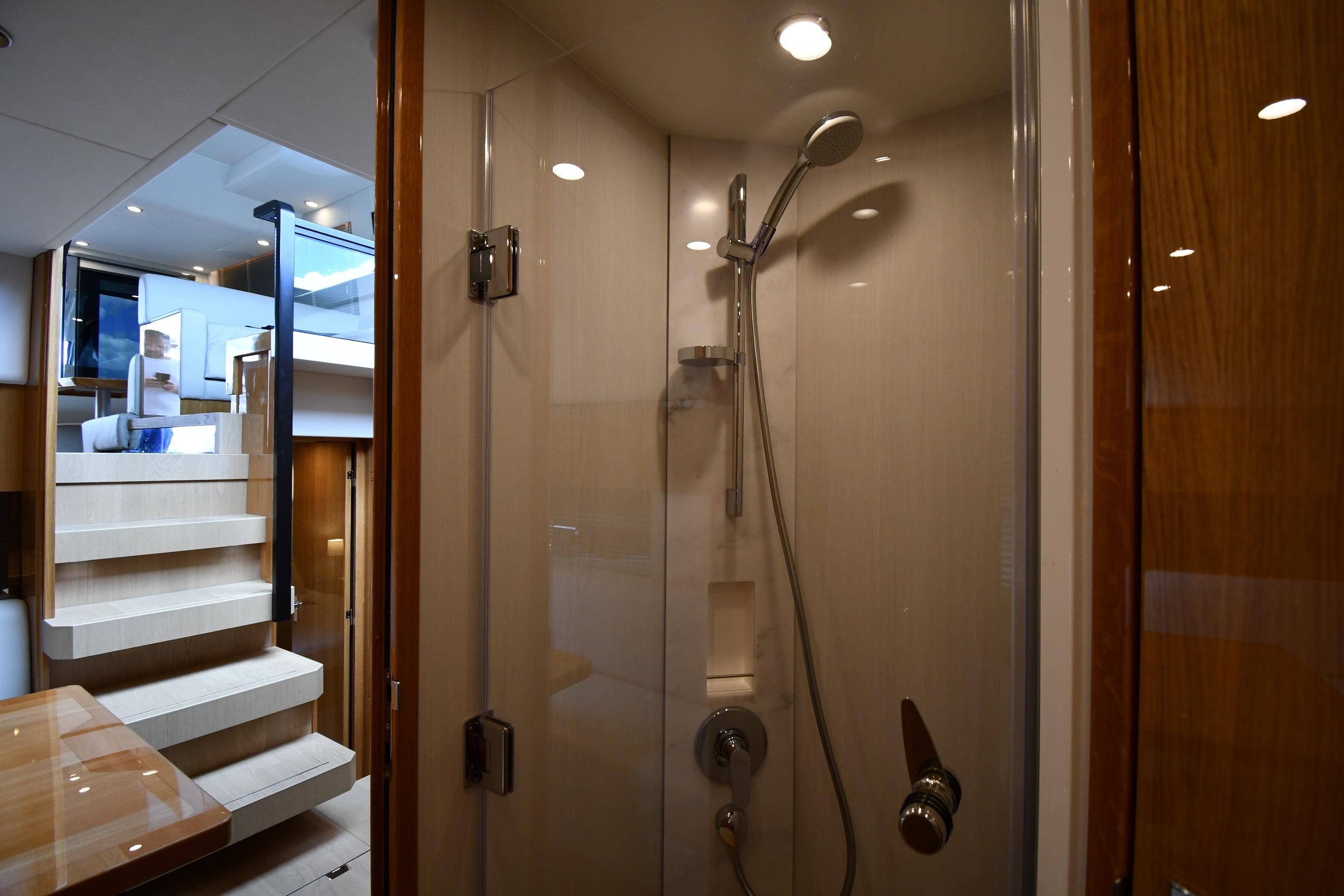 Luxurious bathroom interior on 2024 Fairline G50 Targa yacht, featuring modern shower design.