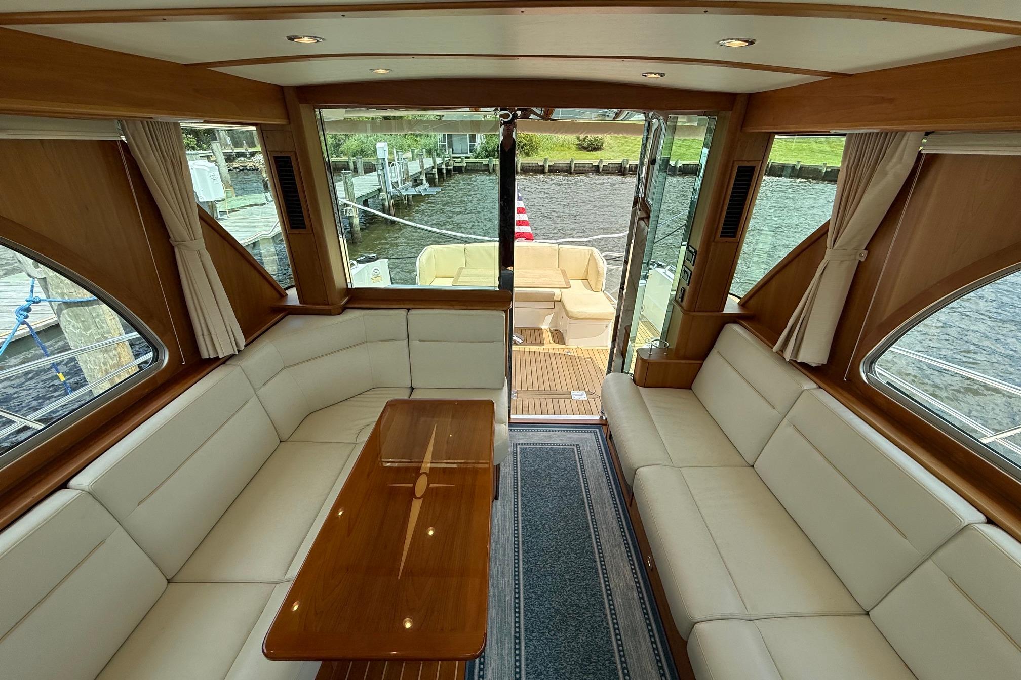 Interior of 2019 Sabre 45 Salon Express yacht with elegant seating and wooden accents.