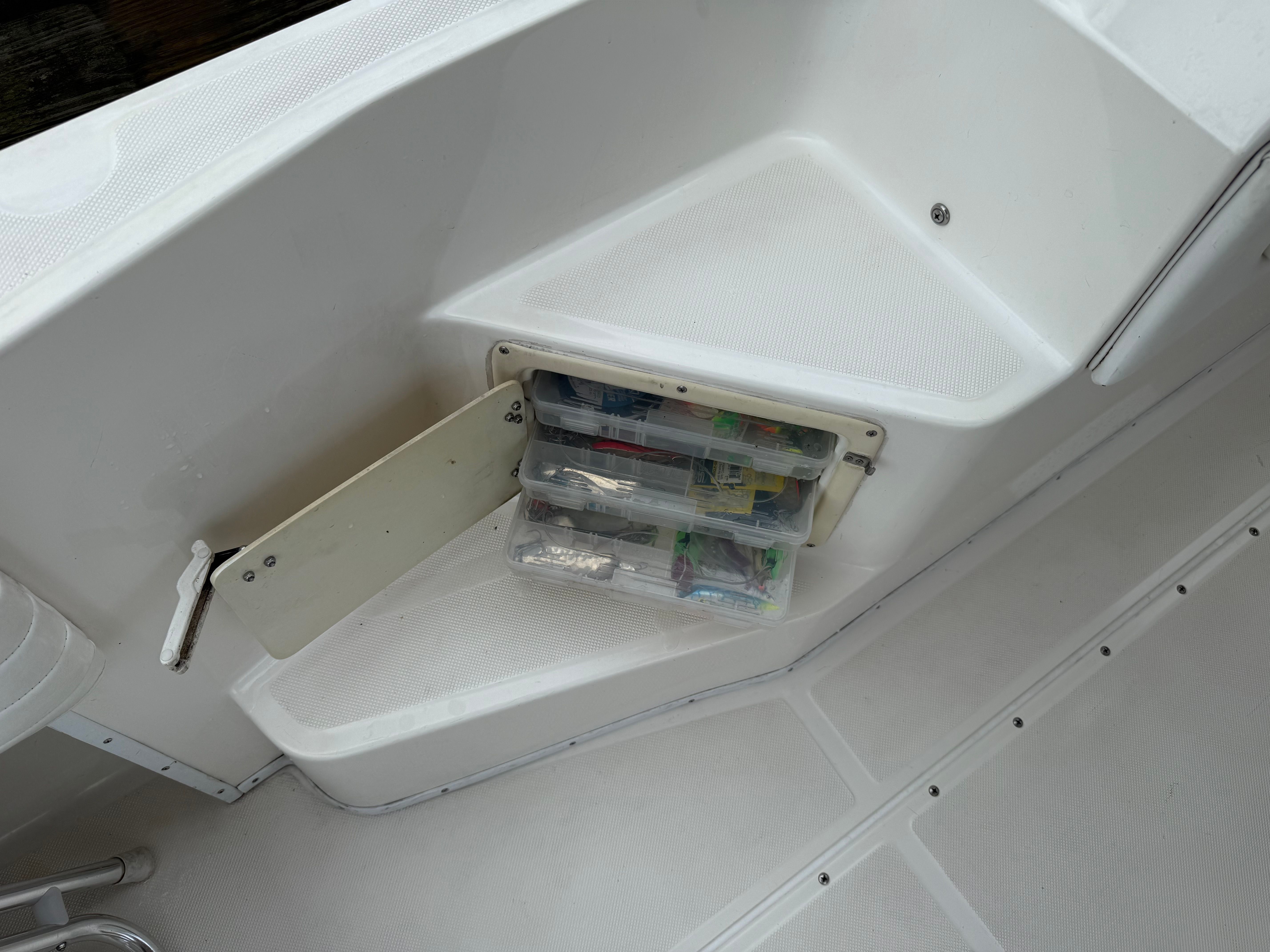 Storage compartment on a 1999 Fountain 32 Sport Fish Cruiser boat.