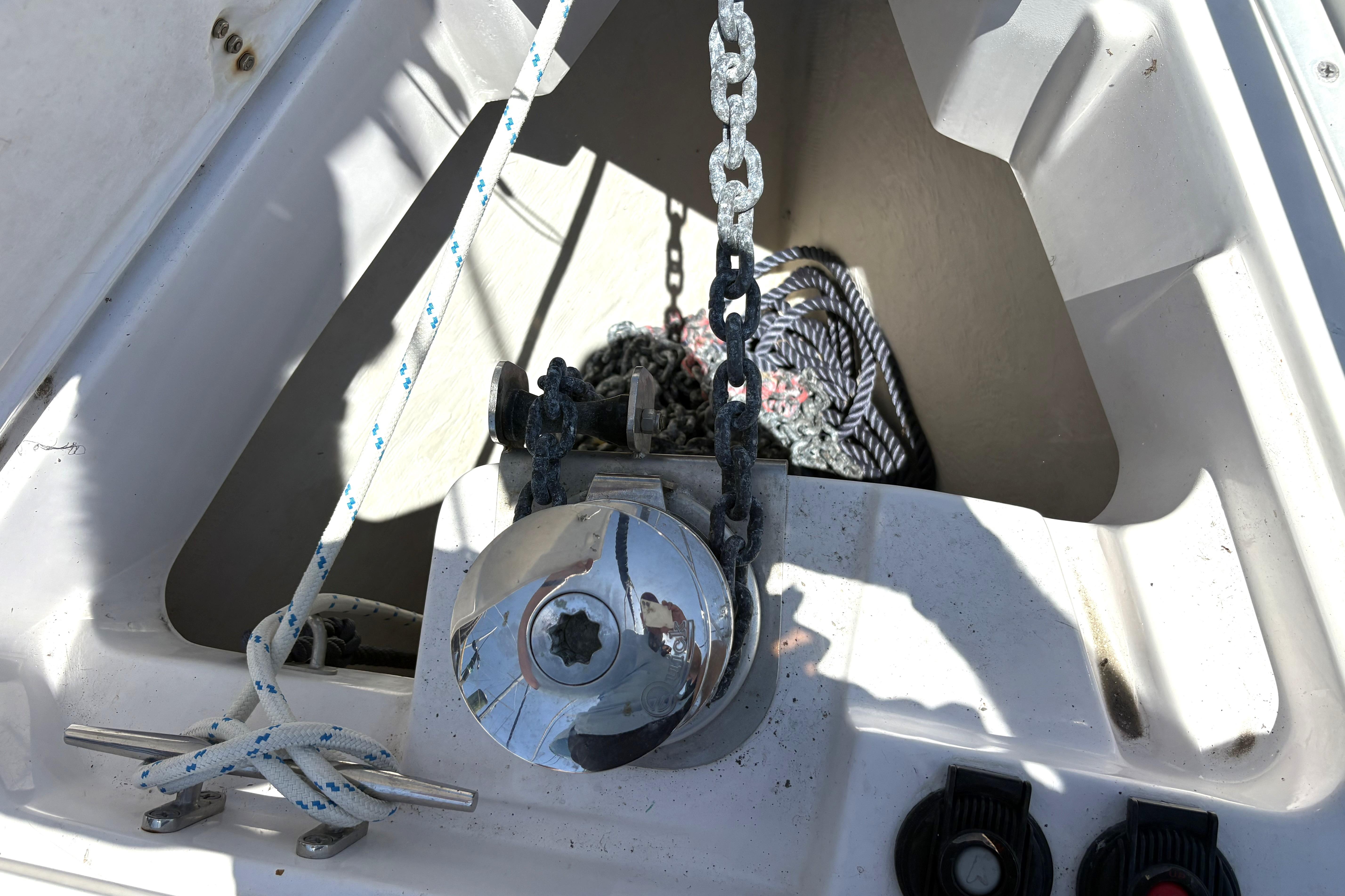 Anchor chain and rope on a 2011 Catalina 355 sailboat deck.