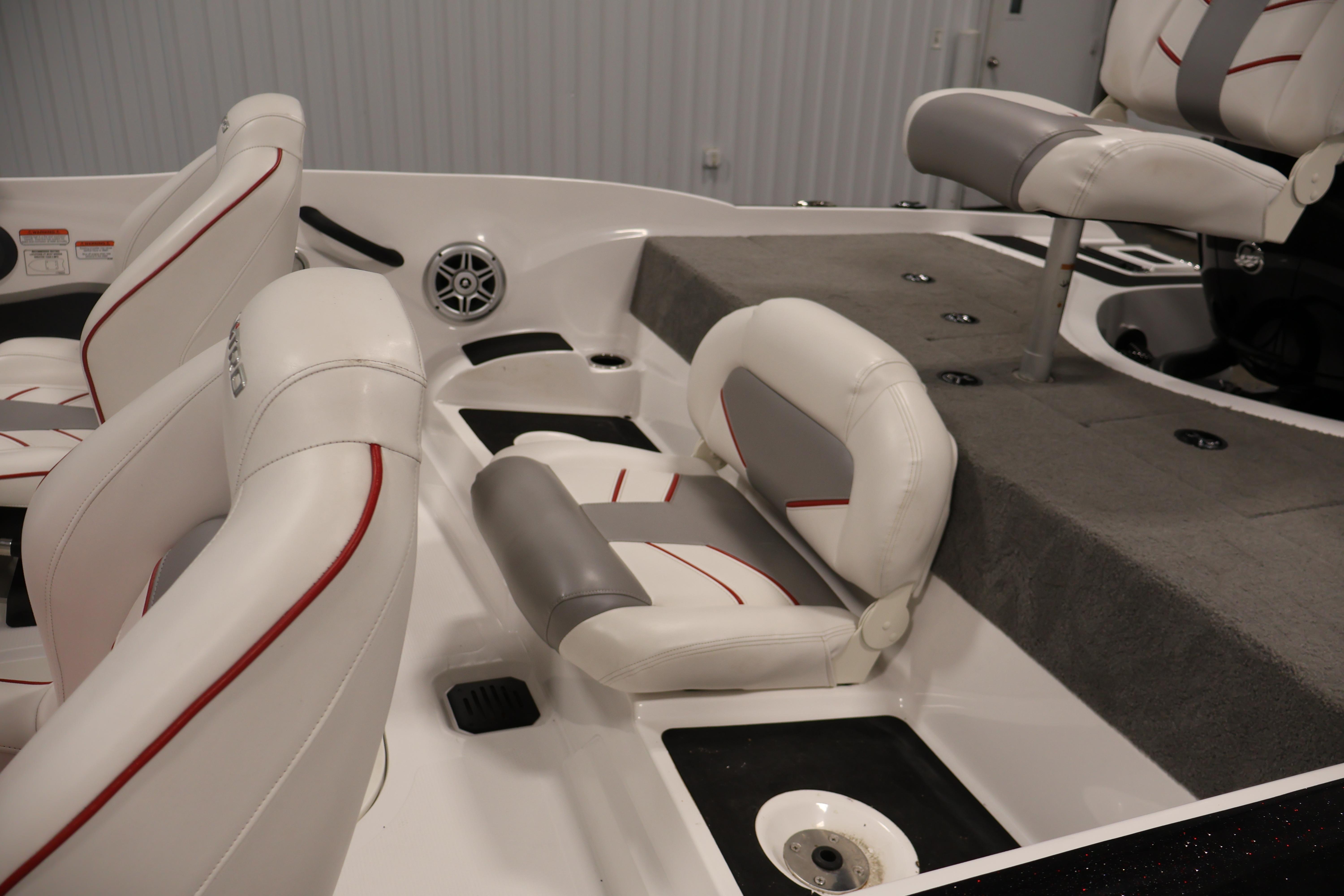 2019 Nitro Z19 Sport boat interior with white and gray seating, red accents.