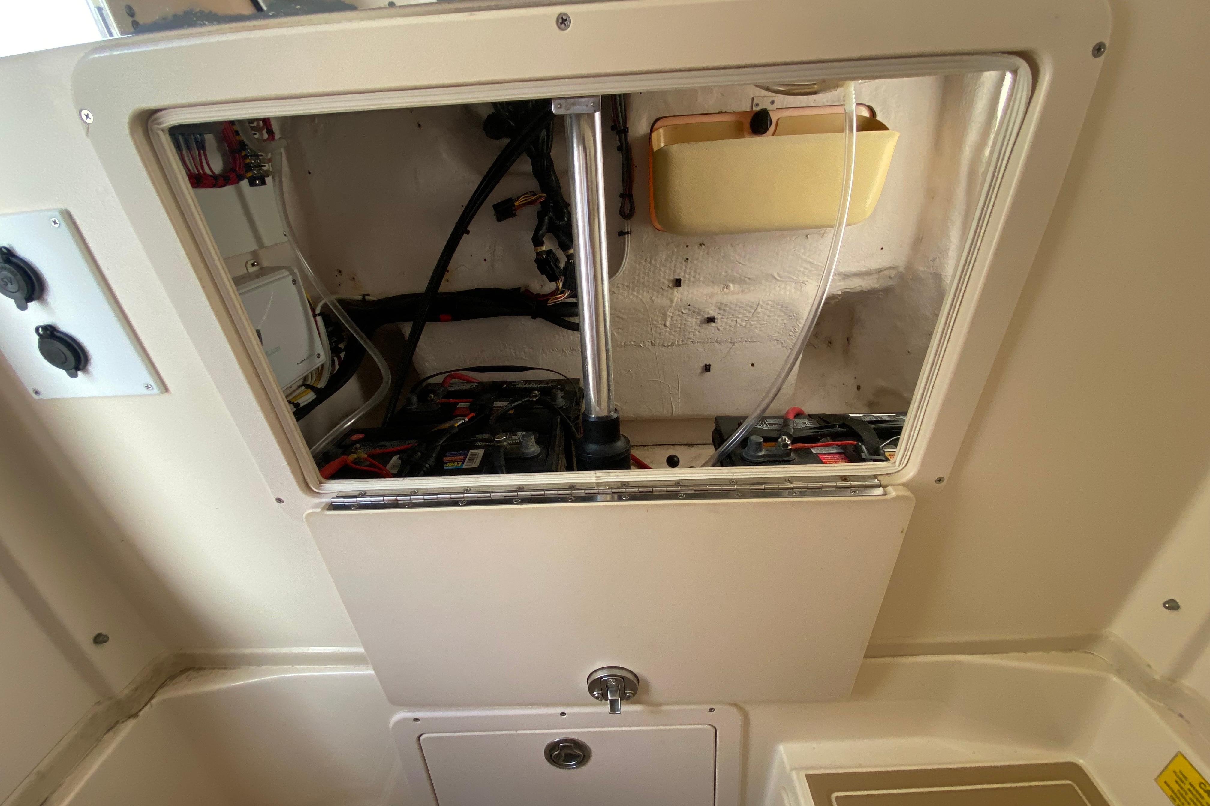 2004 Grady-White Canyon 283 boat interior showing battery compartment and wiring.