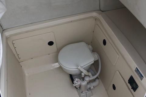 Interior of a 1999 Boston Whaler Outrage 26 with toilet.