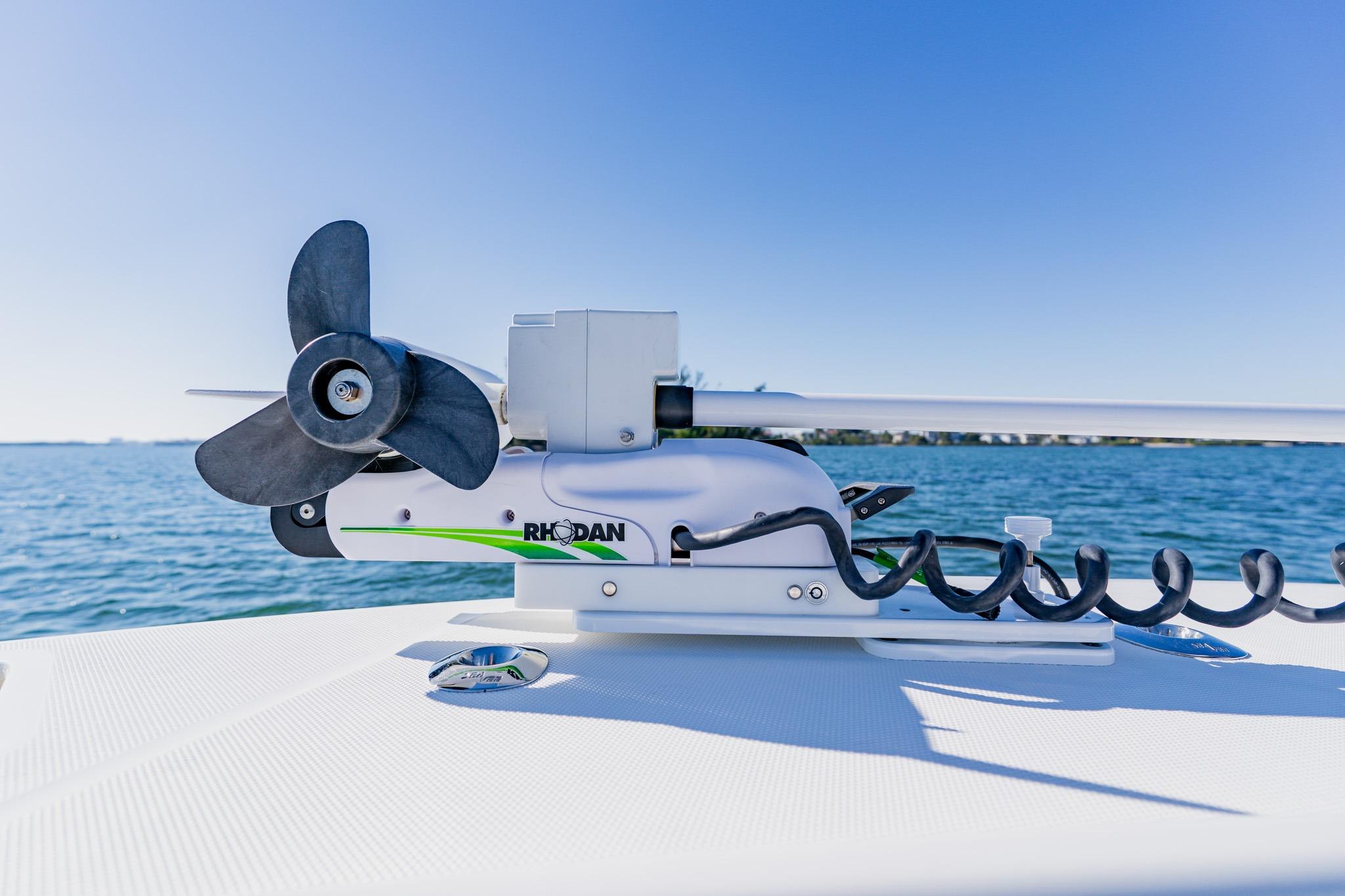 Rhodan trolling motor on 2025 SeaVee 370Z boat, ocean background, clear blue sky.