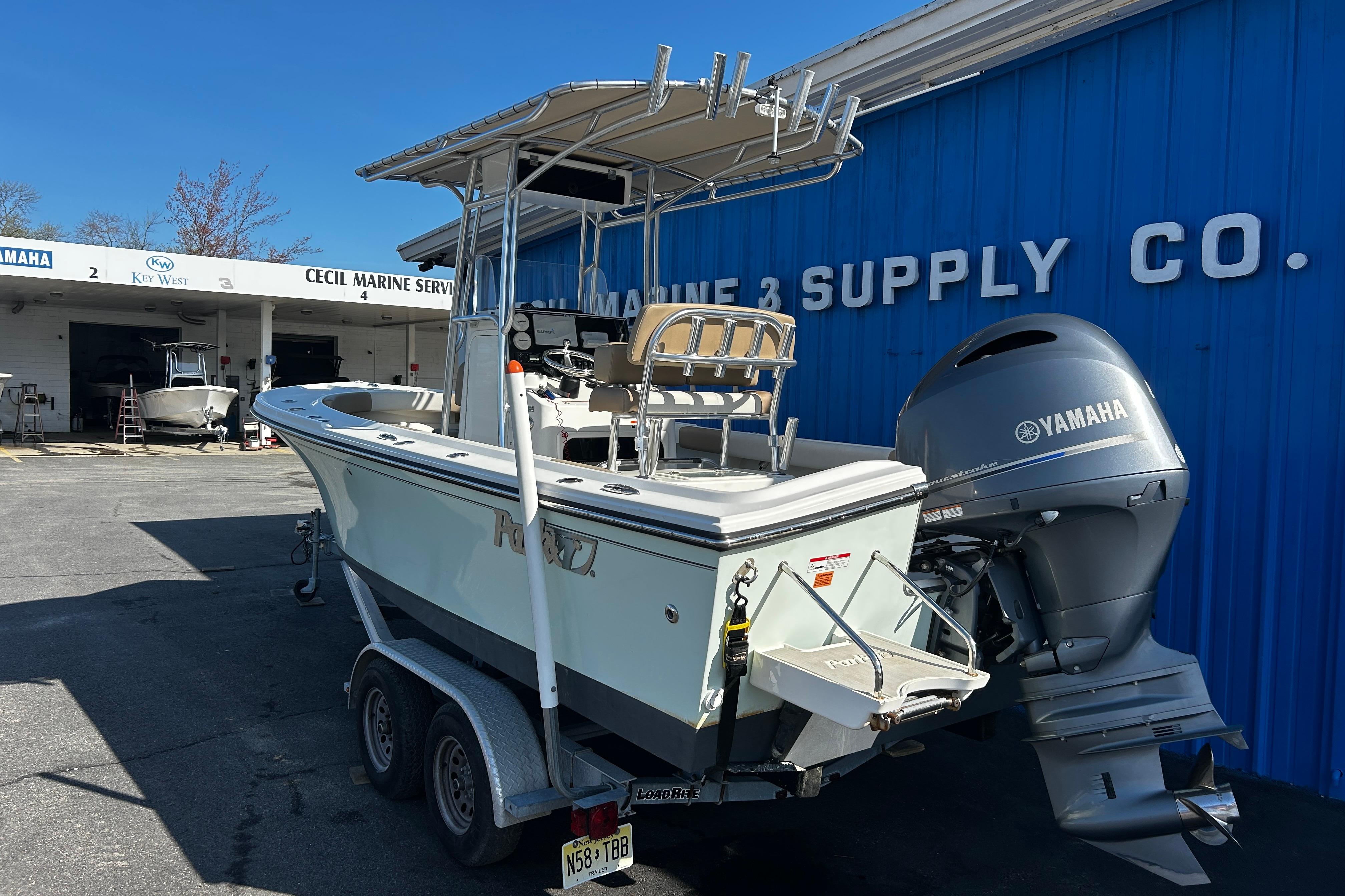 2019 Parker 21 Special Edition boat with Yamaha engine at marine service center.