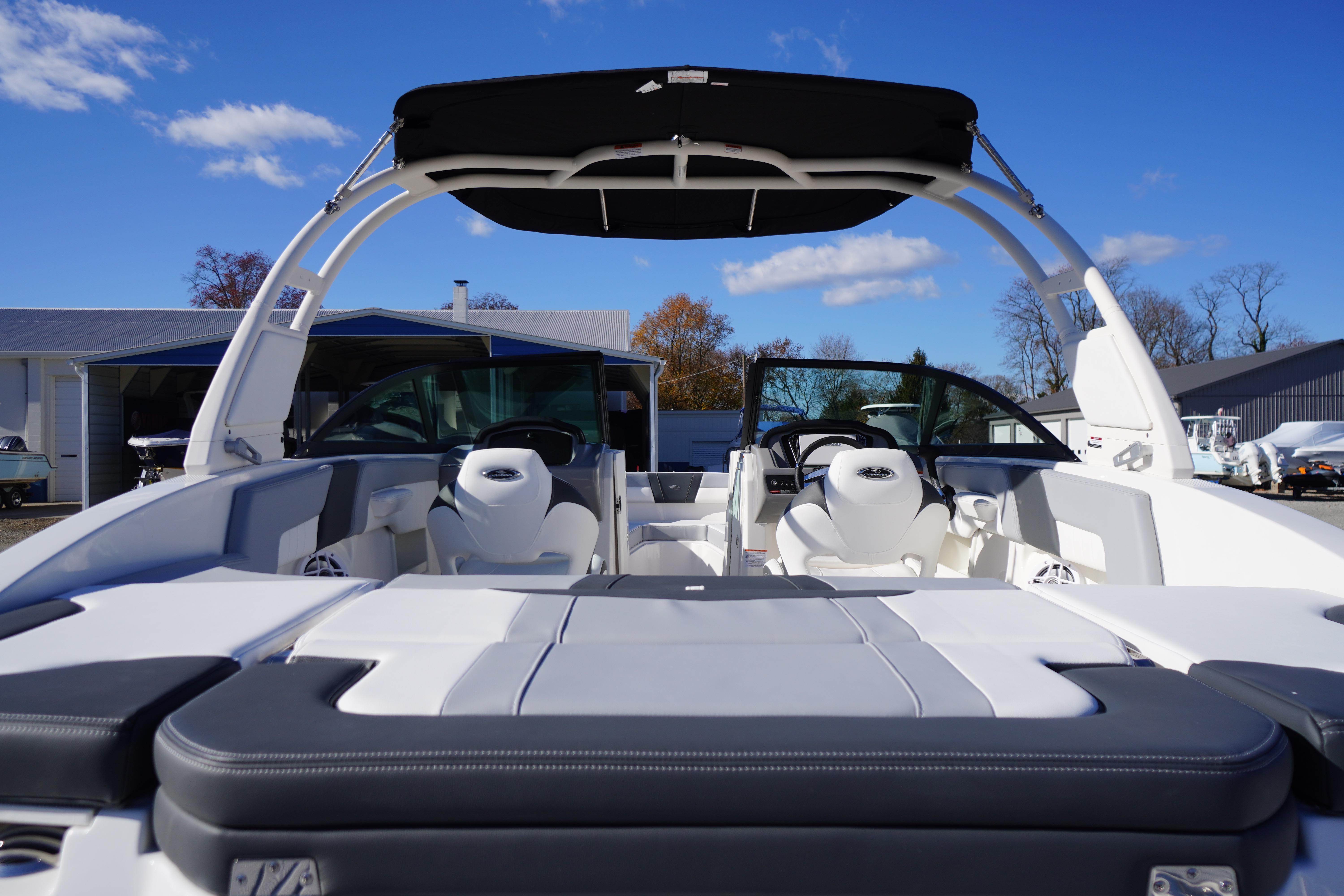 2026 Chaparral 23 SSi boat with sleek interior and modern design under clear blue sky.