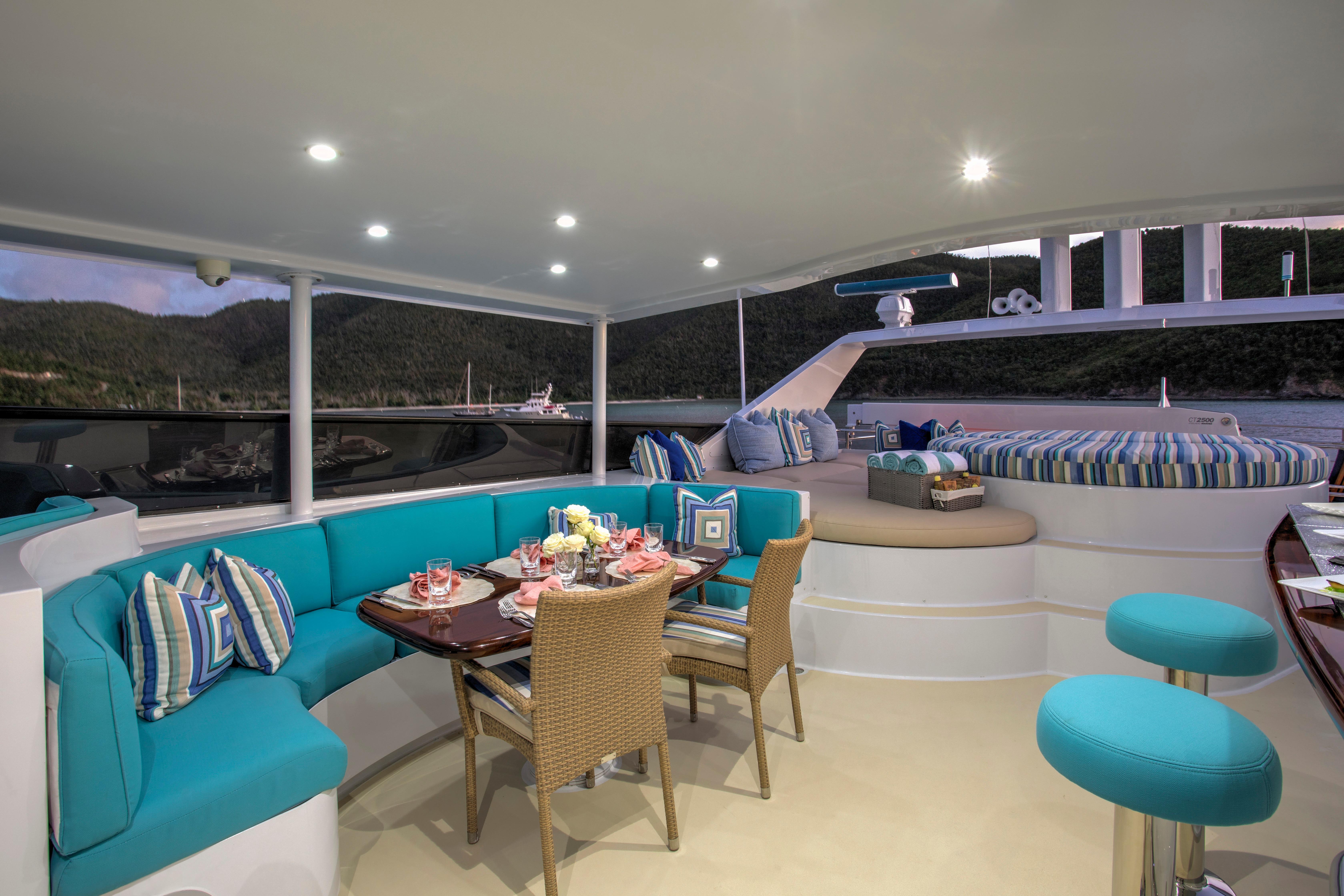 Luxurious 1994 Broward Marine Raised Pilothouse yacht interior with elegant seating and dining area.