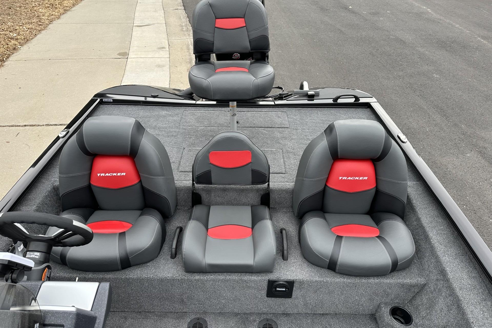 2025 Tracker Savage 215 boat interior with gray and red seating.