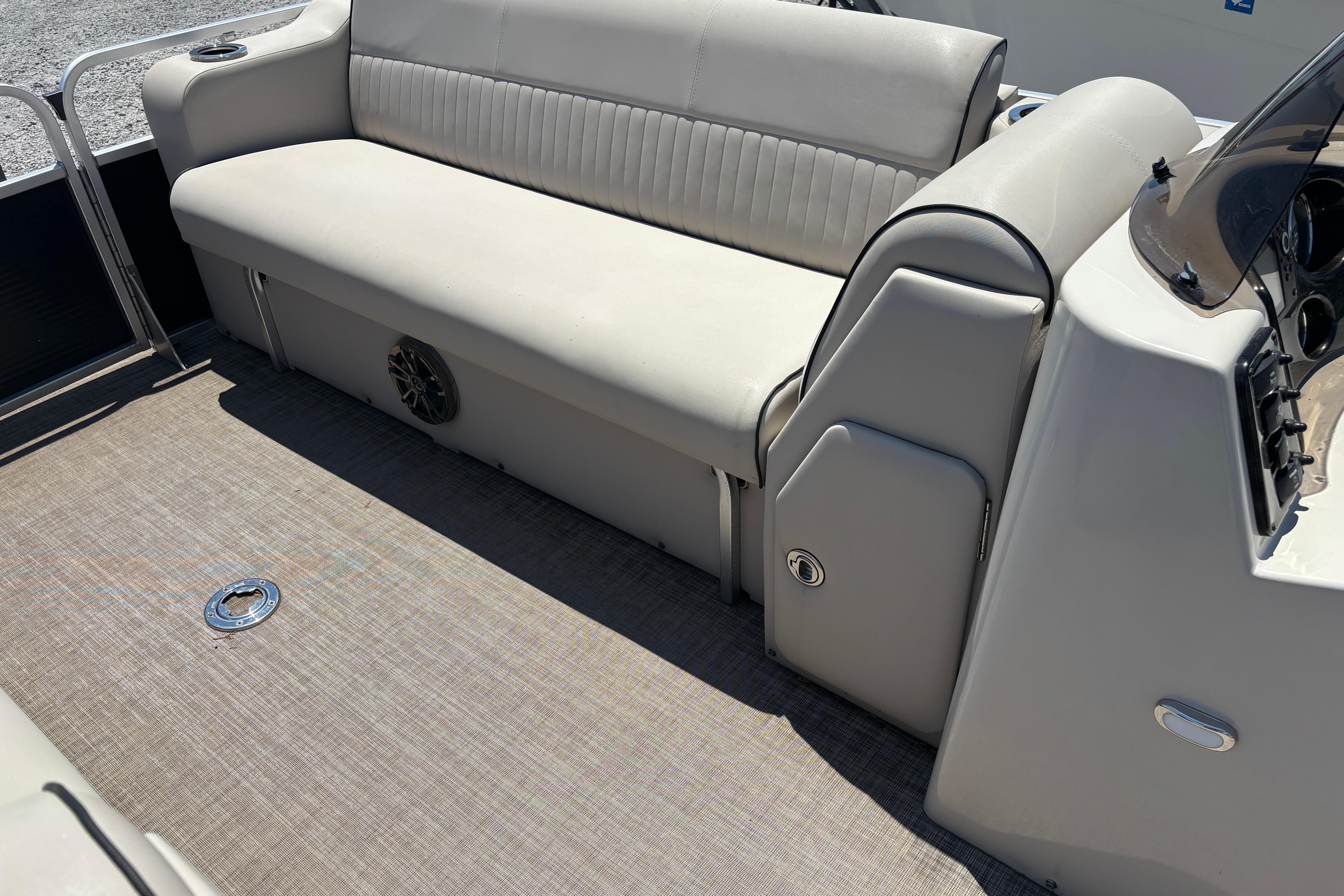 Interior of 2017 Qwest LS 822 Bar pontoon boat with beige seating and flooring.