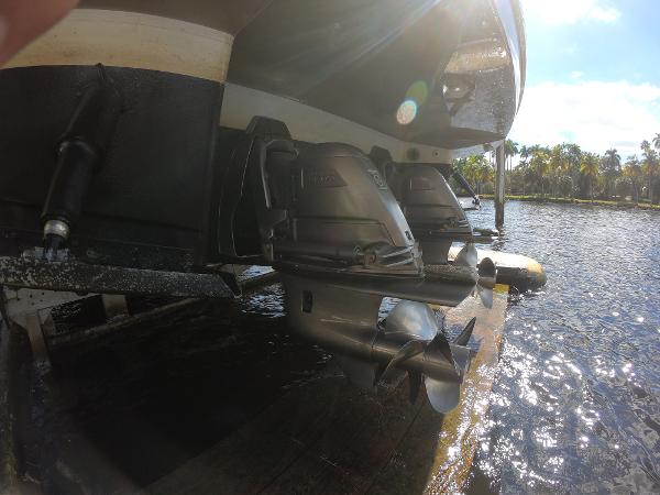 2017 Jeanneau NC 11 boat propellers and stern drive in water.