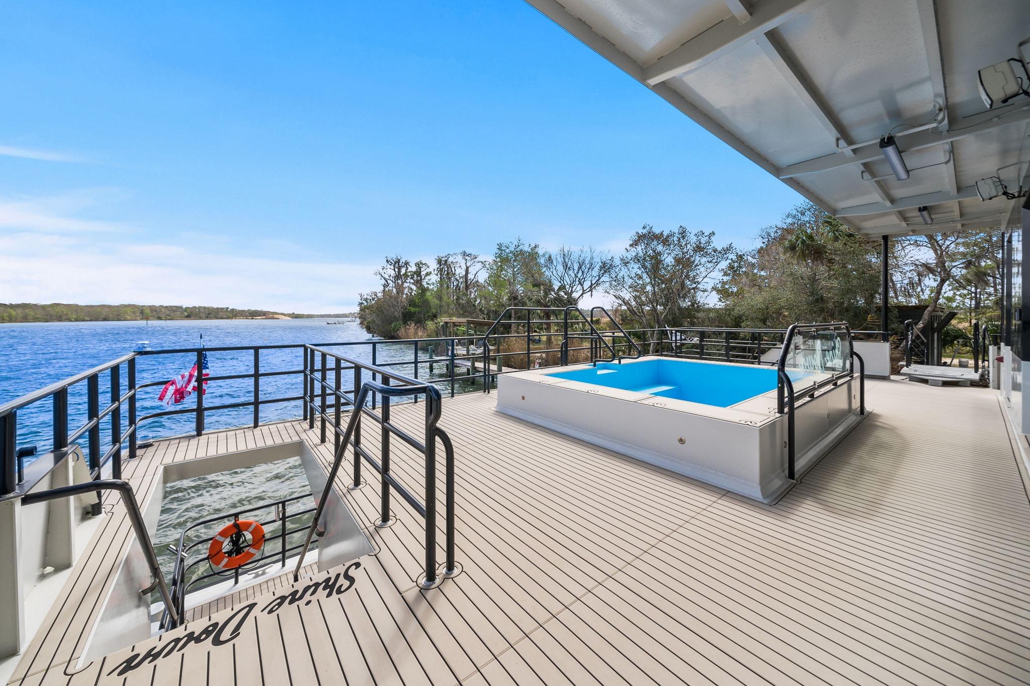 Luxurious Breaux Brothers 120 GLV yacht deck with pool, overlooking serene waters, 2025 model.
