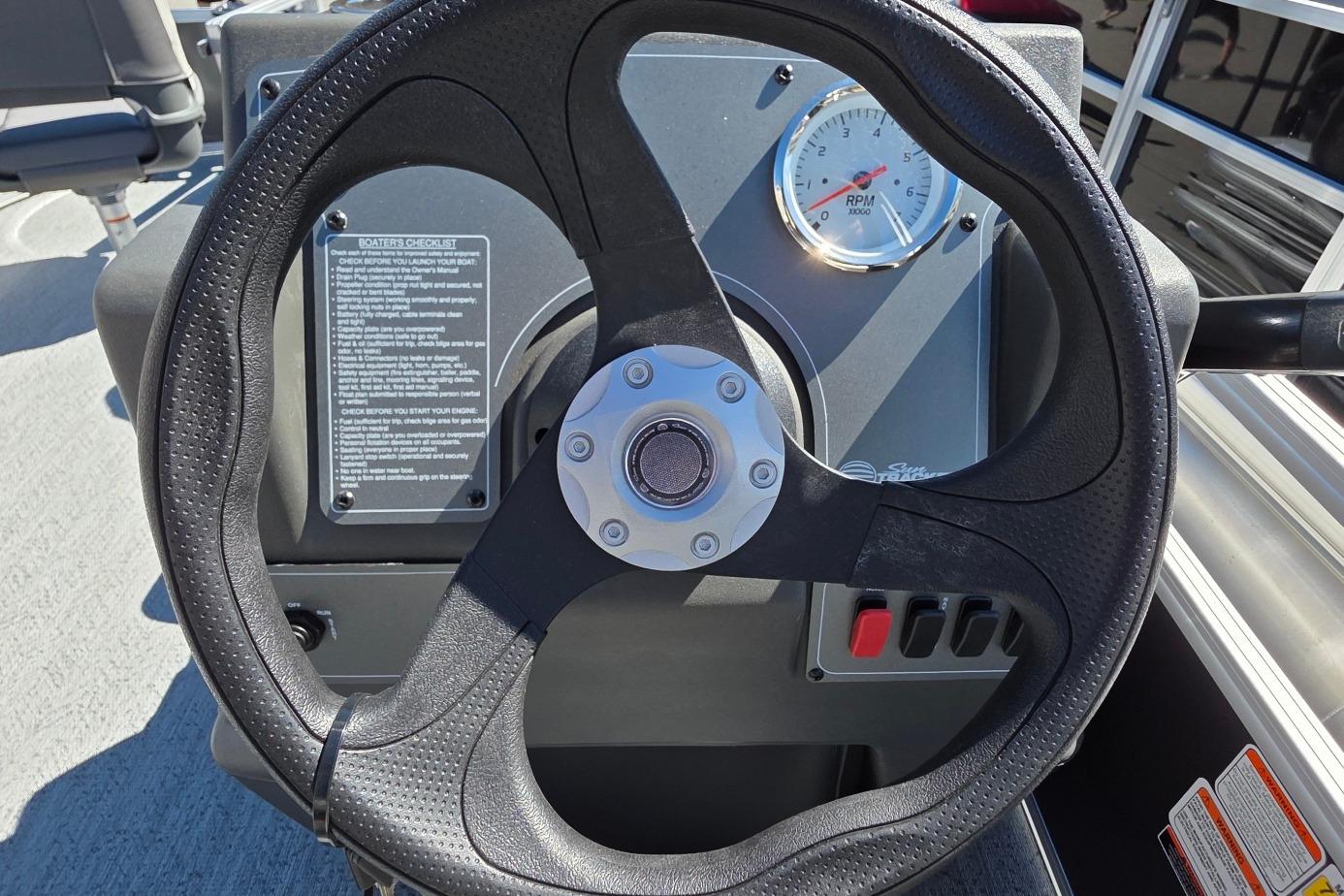 Steering wheel and dashboard of 2026 Sun Tracker BB 16 XLS boat.