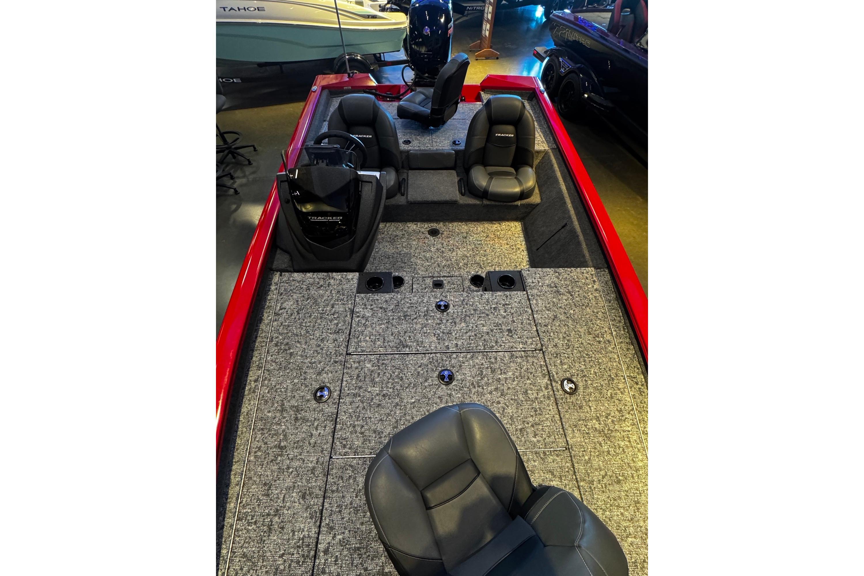 2026 Tracker Pro Team 195 boat interior with gray carpet and black seats.