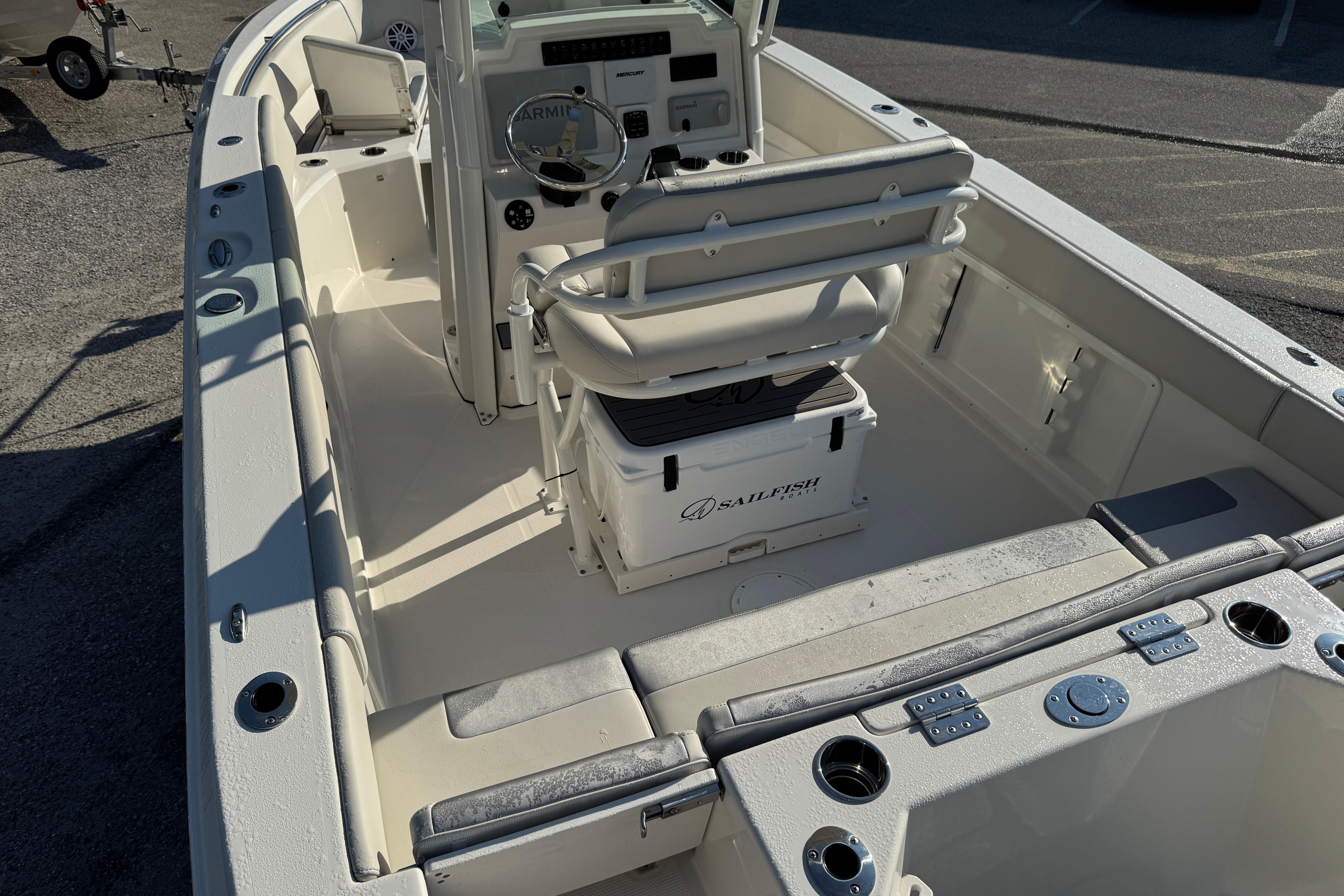 2026 Sailfish 232 CC boat interior with helm, seating, and storage compartments.