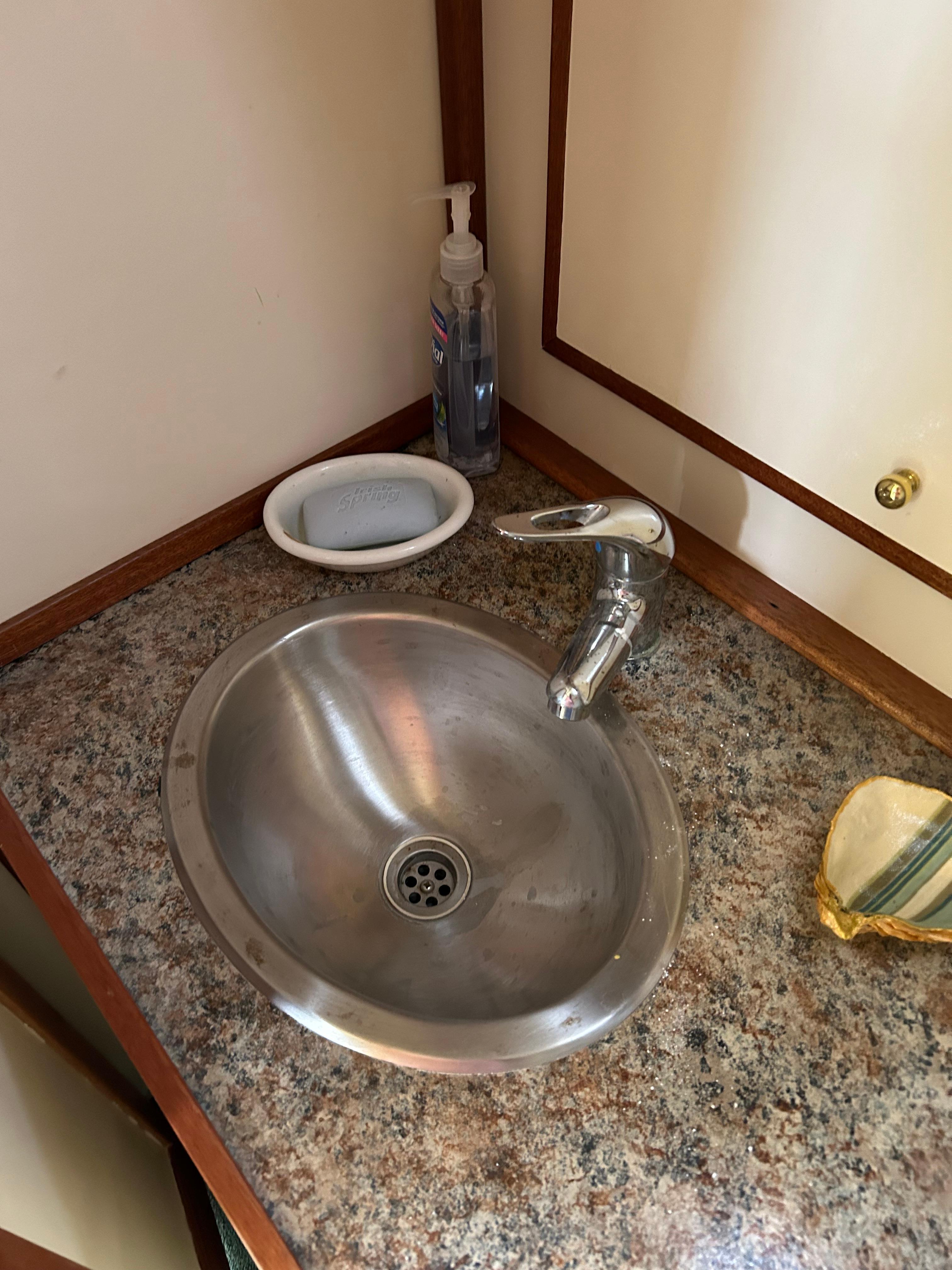 Stainless steel sink on Mast & Mallet 34 Rabbit Custom boat, 1996 model.