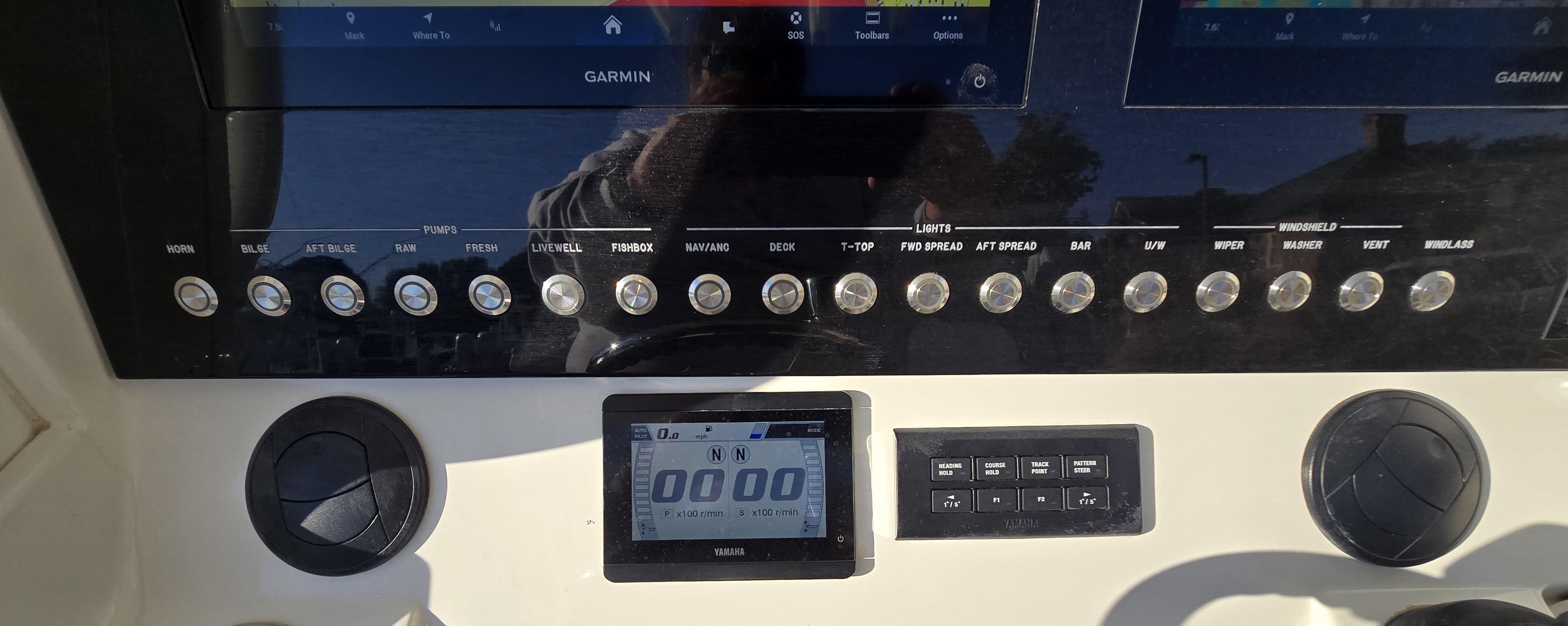 2021 Regulator 34 Center Console dashboard with Garmin displays and control buttons.