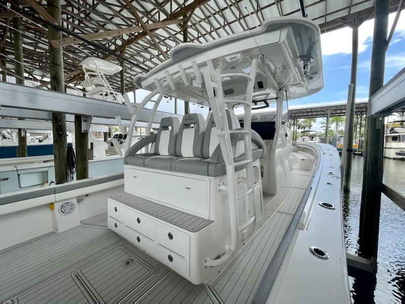 2020 Regulator 41 boat with seating and storage, docked in a covered marina.