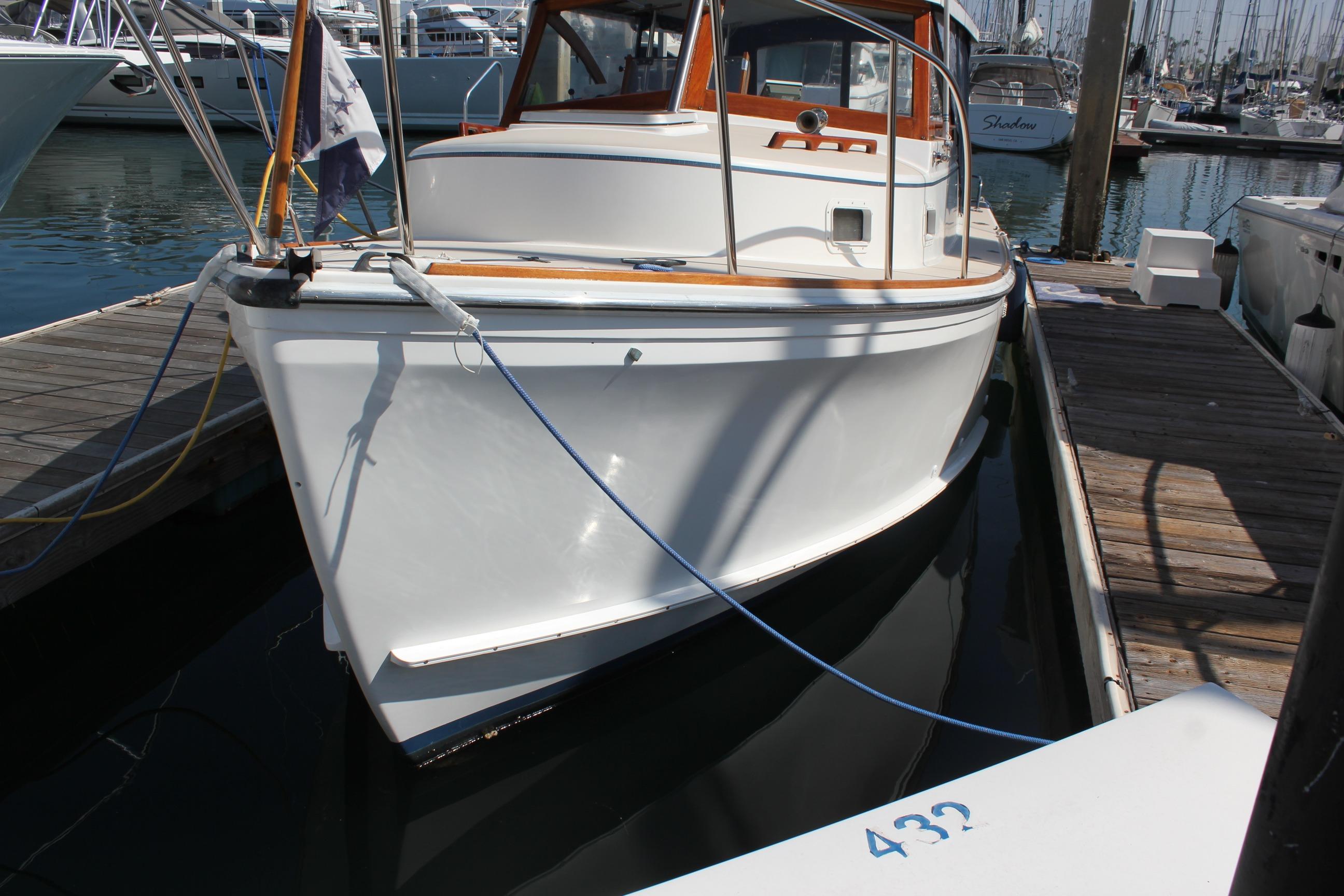 1988 Cape Dory 28 Hardtop boat docked at marina, showcasing classic design and craftsmanship.