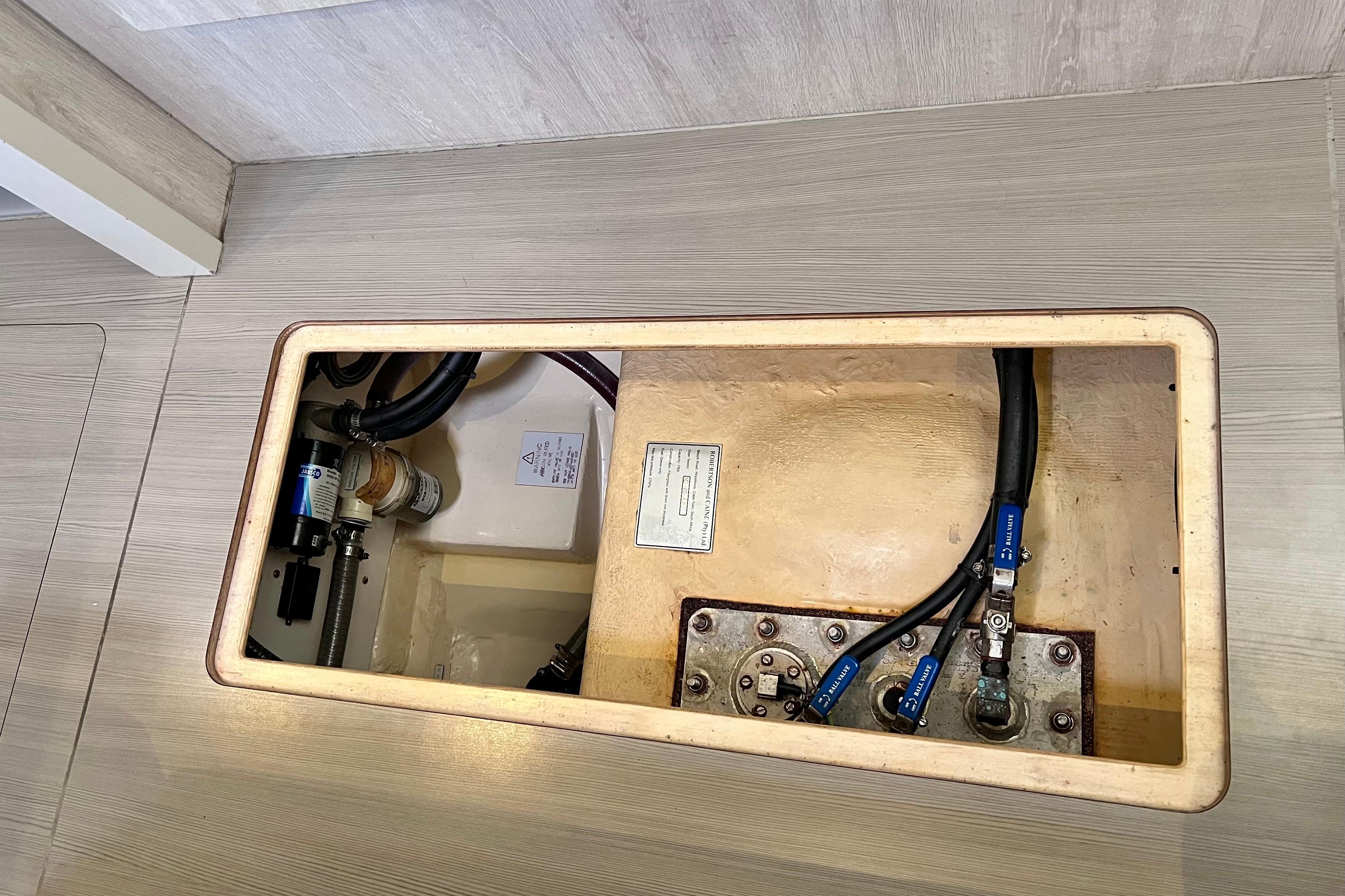 2019 Leopard 51 Powercat engine compartment with visible hoses and components.