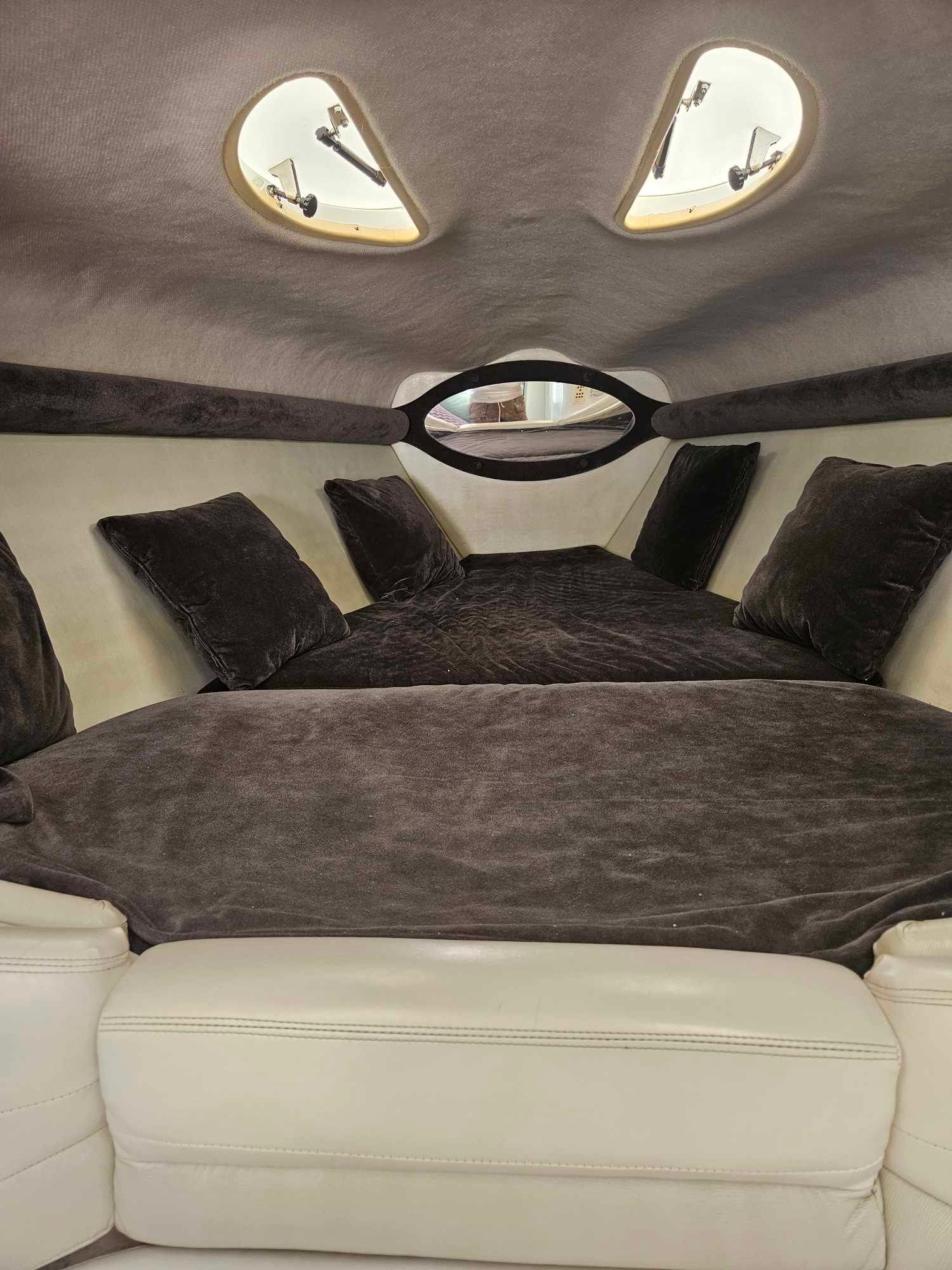 Interior of a 1997 Baja 38 Special Boss boat with luxurious cushions.