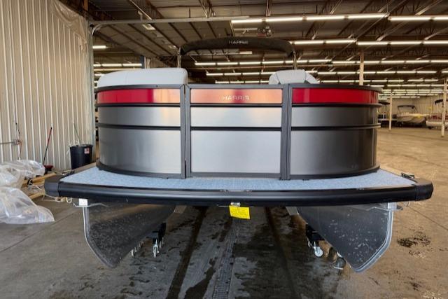 2025 Harris Cruiser 230 pontoon boat in a warehouse setting.
