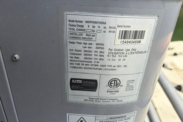 Label on HVAC unit with specifications and certifications, Stardust Houseboat 18x83, 1997 model.