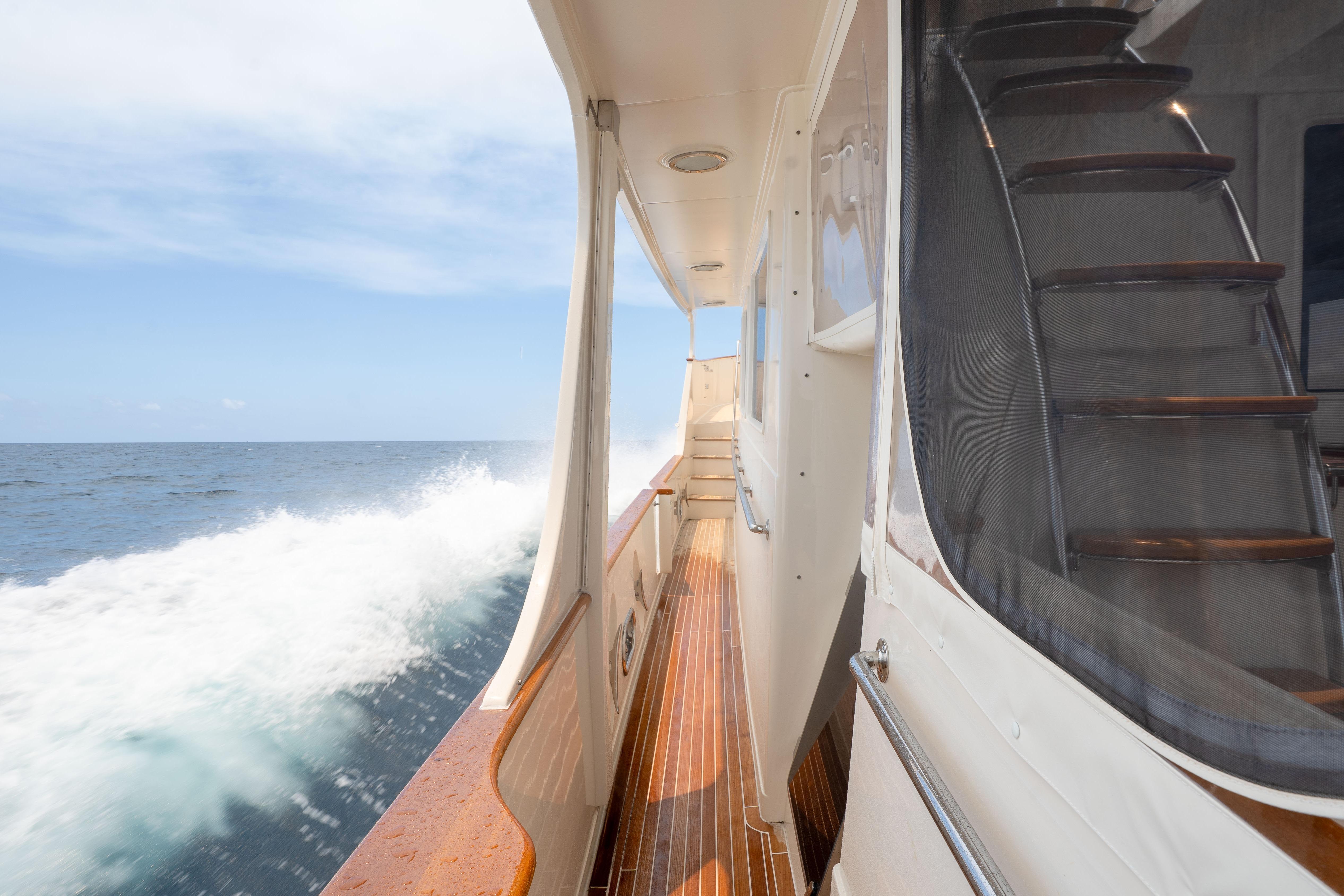 Side view of a 2006 Fleming 75 yacht cruising on open water.