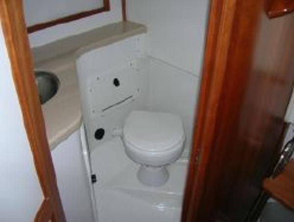 2007 Back Cove 29 boat bathroom with sink and toilet.