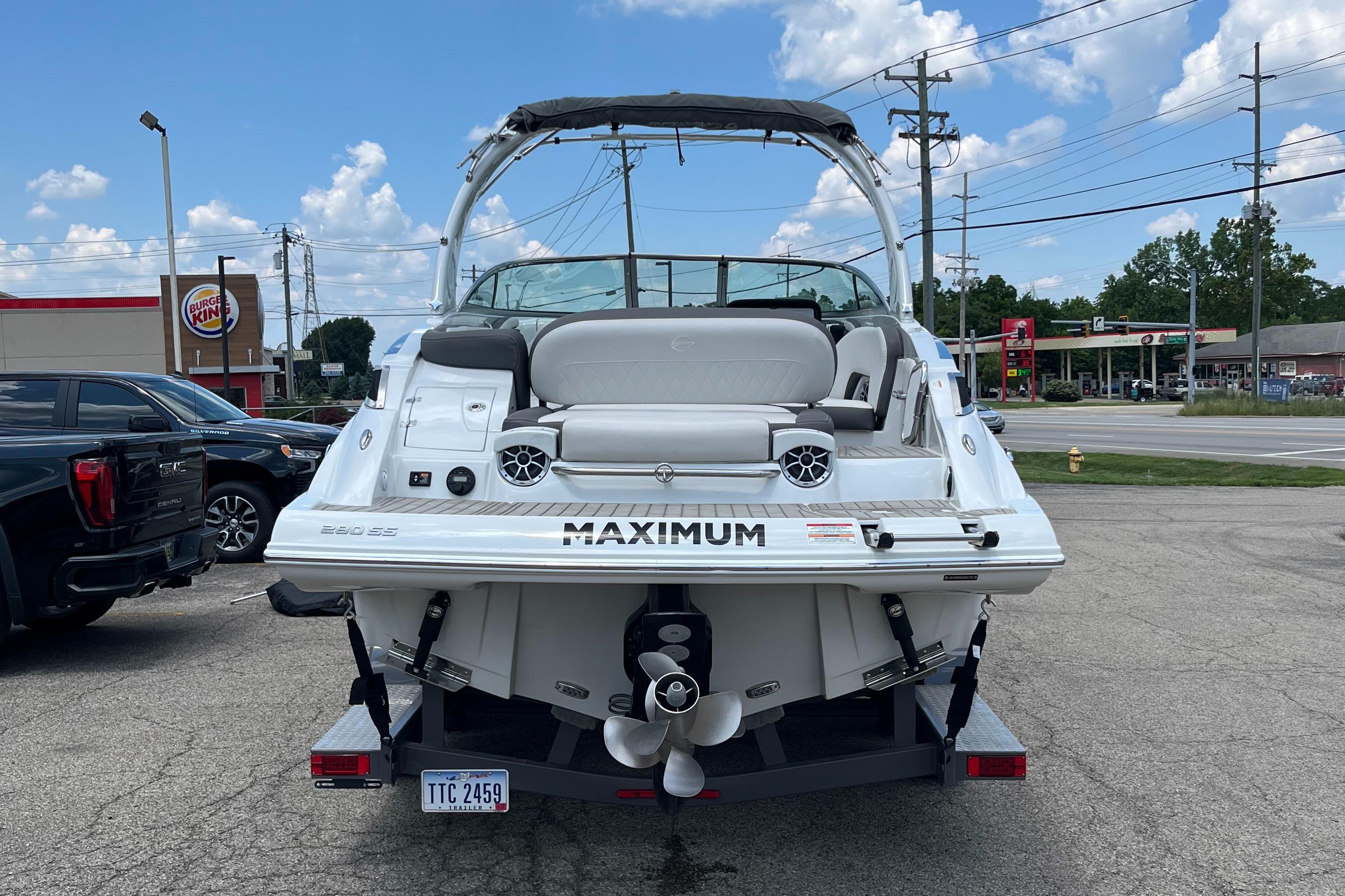 2022 Crownline 280 SS boat parked in a lot, rear view with visible propeller.