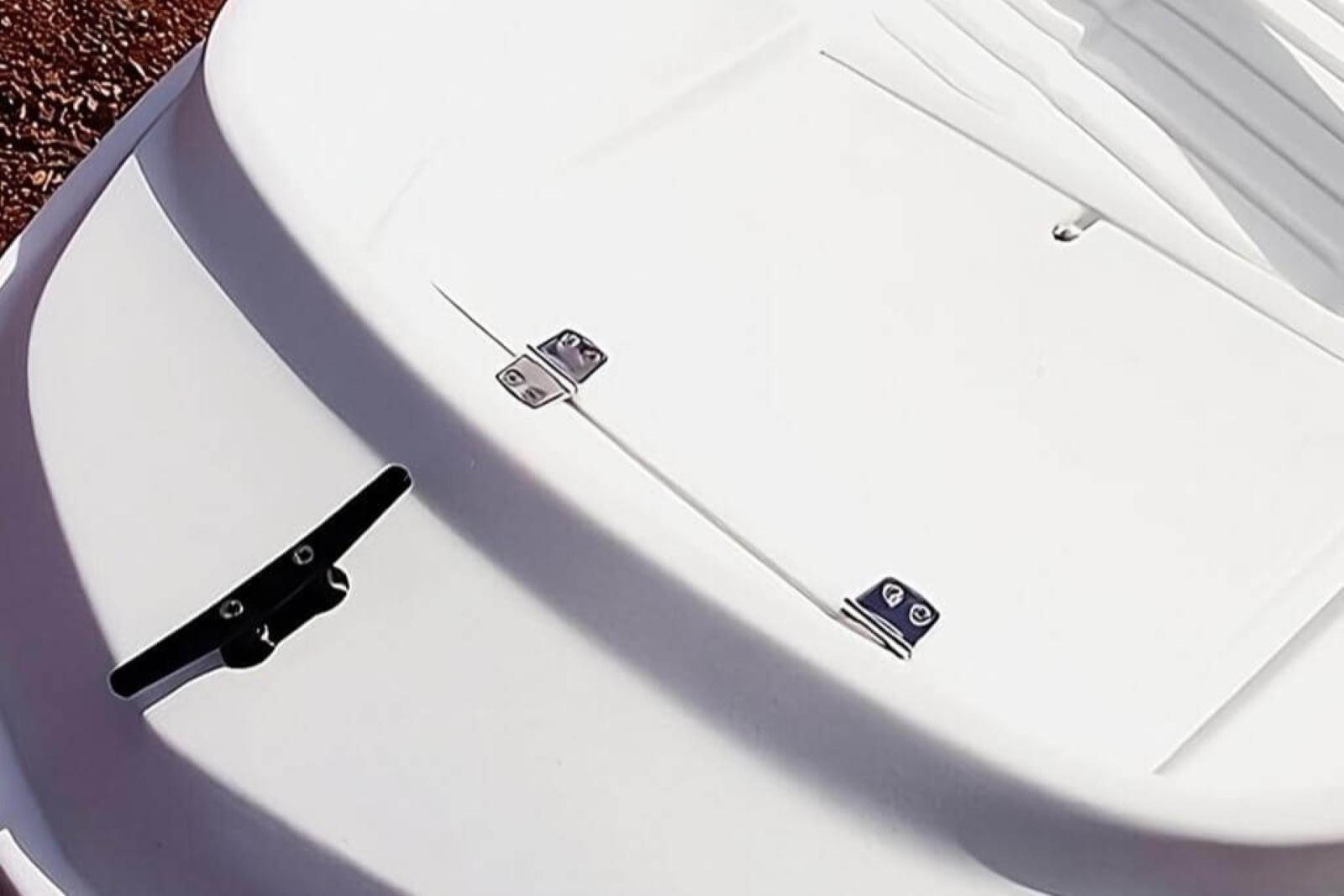 2022 Rigiflex Cap 300 boat deck with cleat and hinges, close-up view.