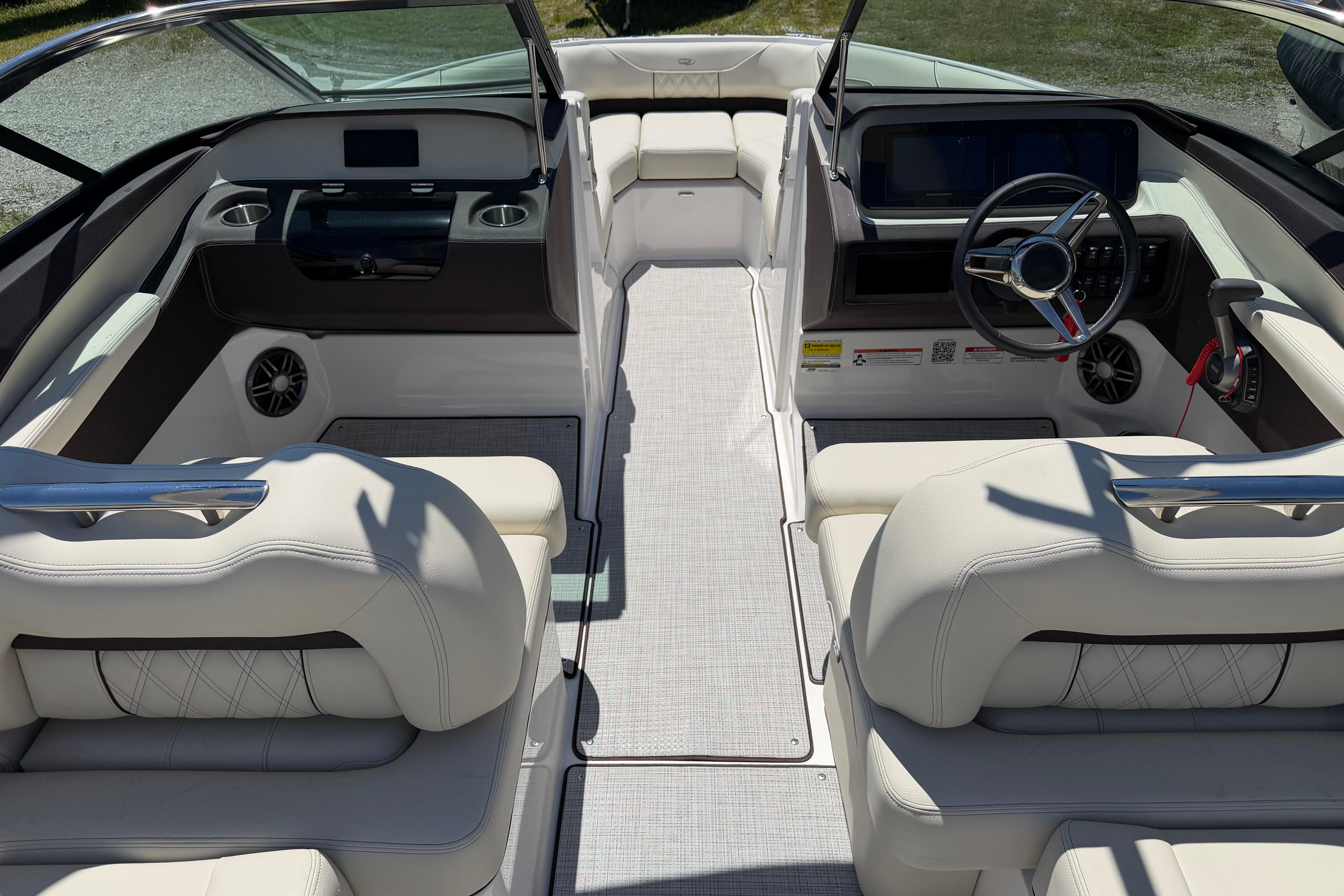 Luxurious interior of 2026 Regal LS4 boat with modern dashboard and plush seating.