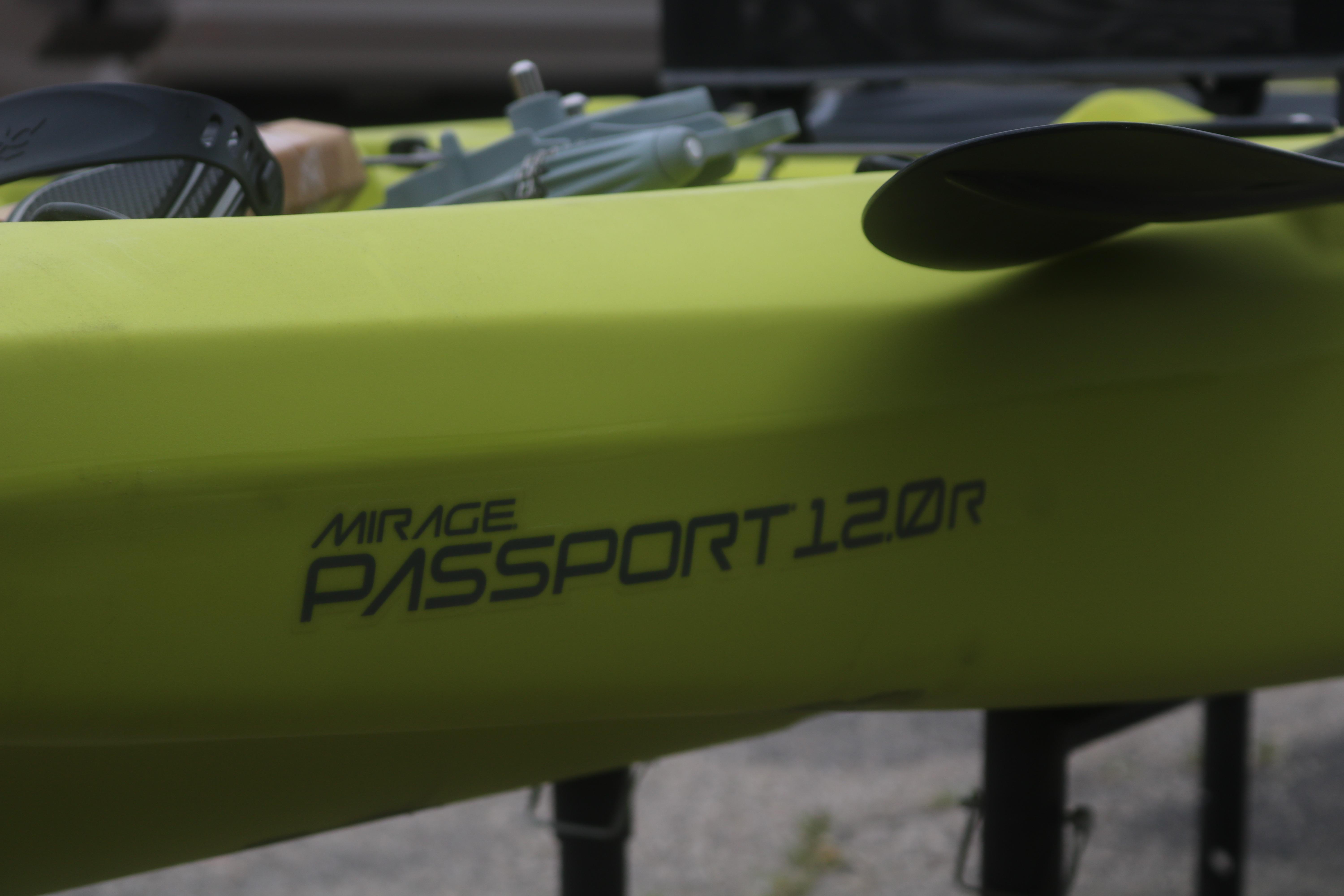 2025 Hobie Mirage Passport 12.0 R kayak in vibrant green with paddle.