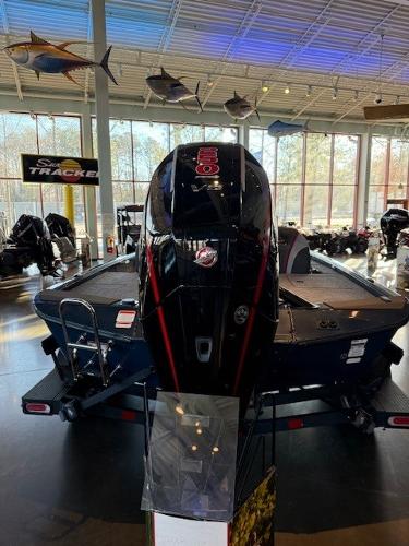 2025 Ranger ALPHA 208 boat displayed indoors with mounted motor.