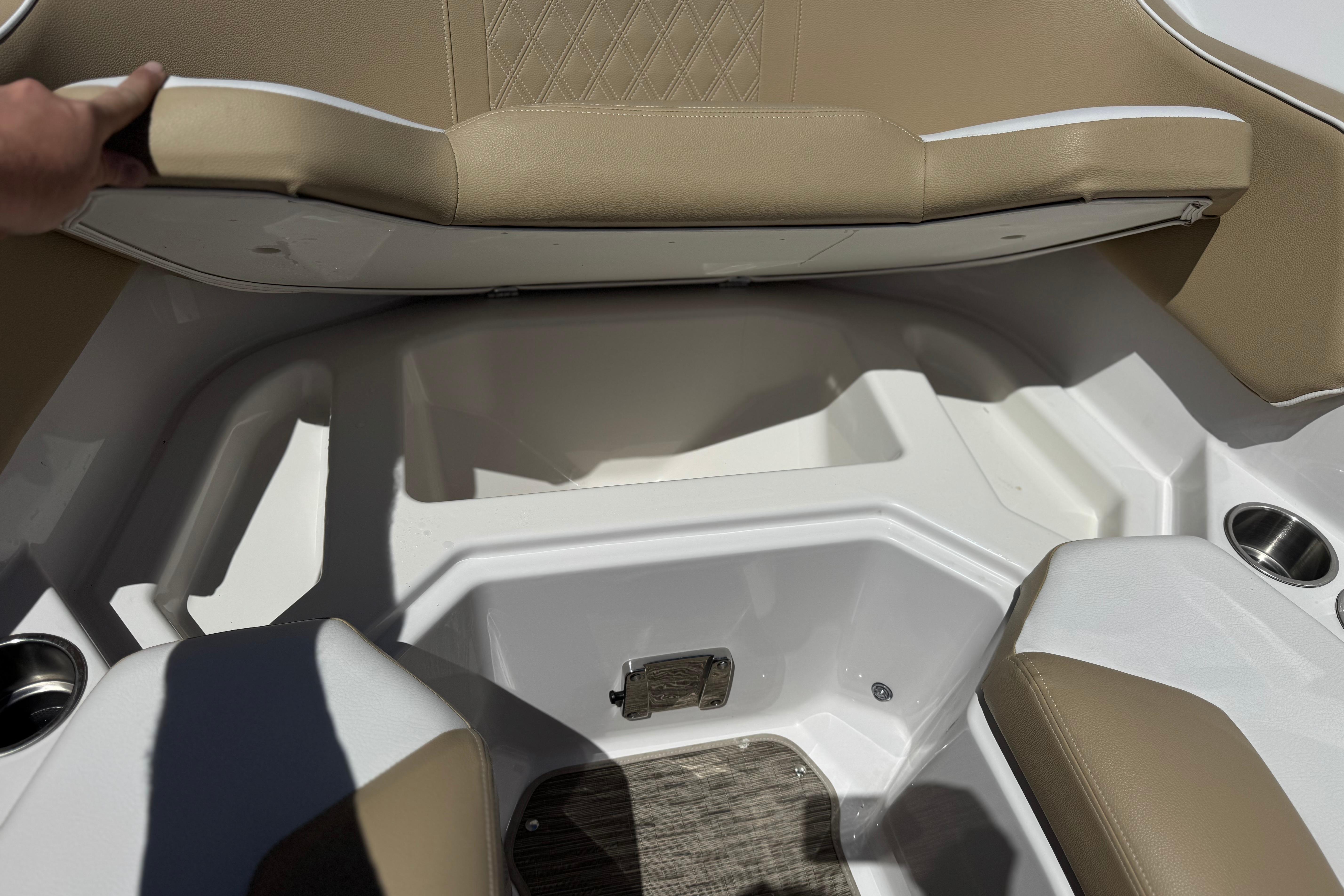 Interior seating of 2017 Scarab 255 H.O. Platinum boat with beige upholstery.