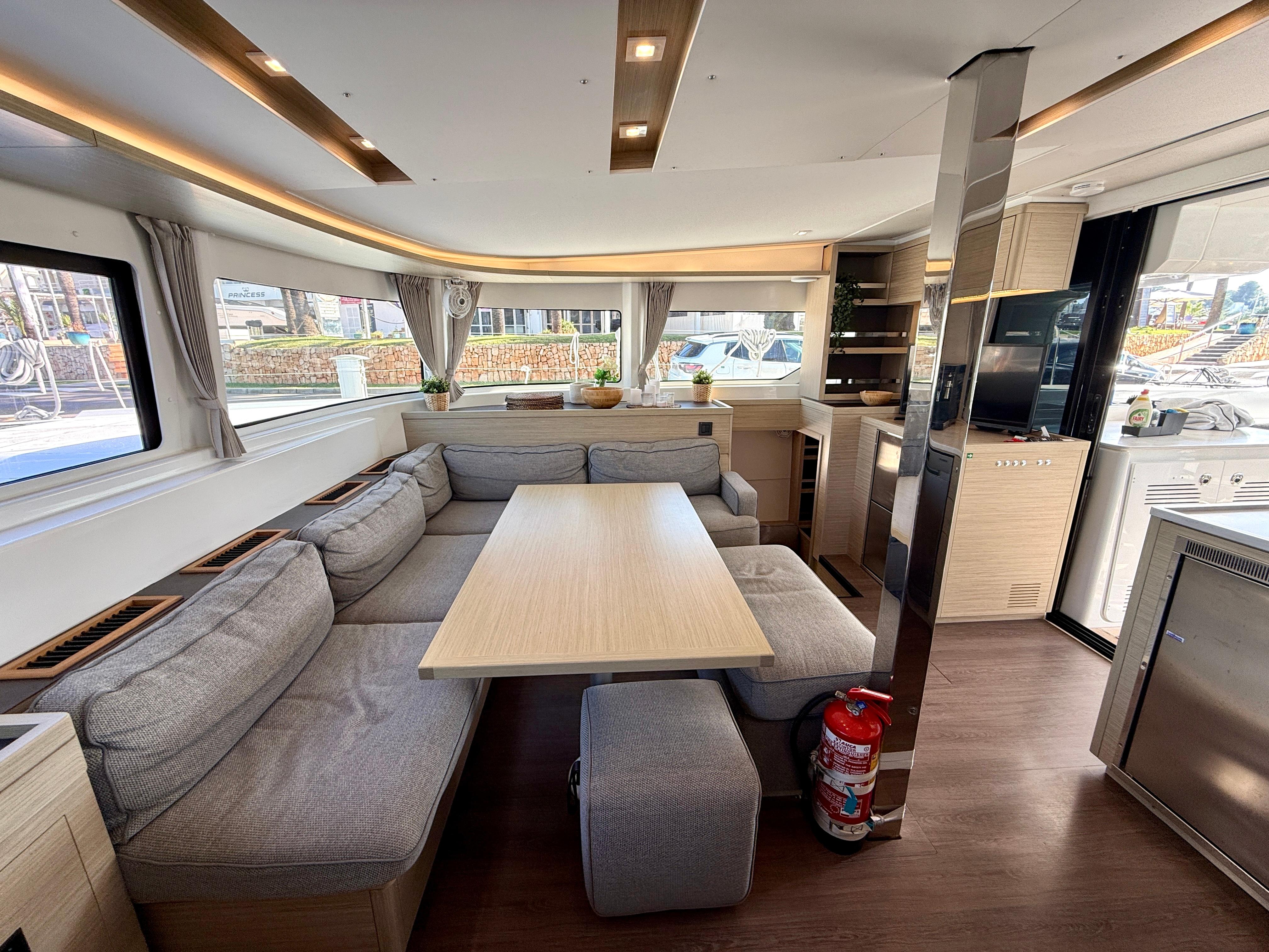 Luxurious interior of 2023 Lagoon 46 catamaran with spacious seating and modern amenities.