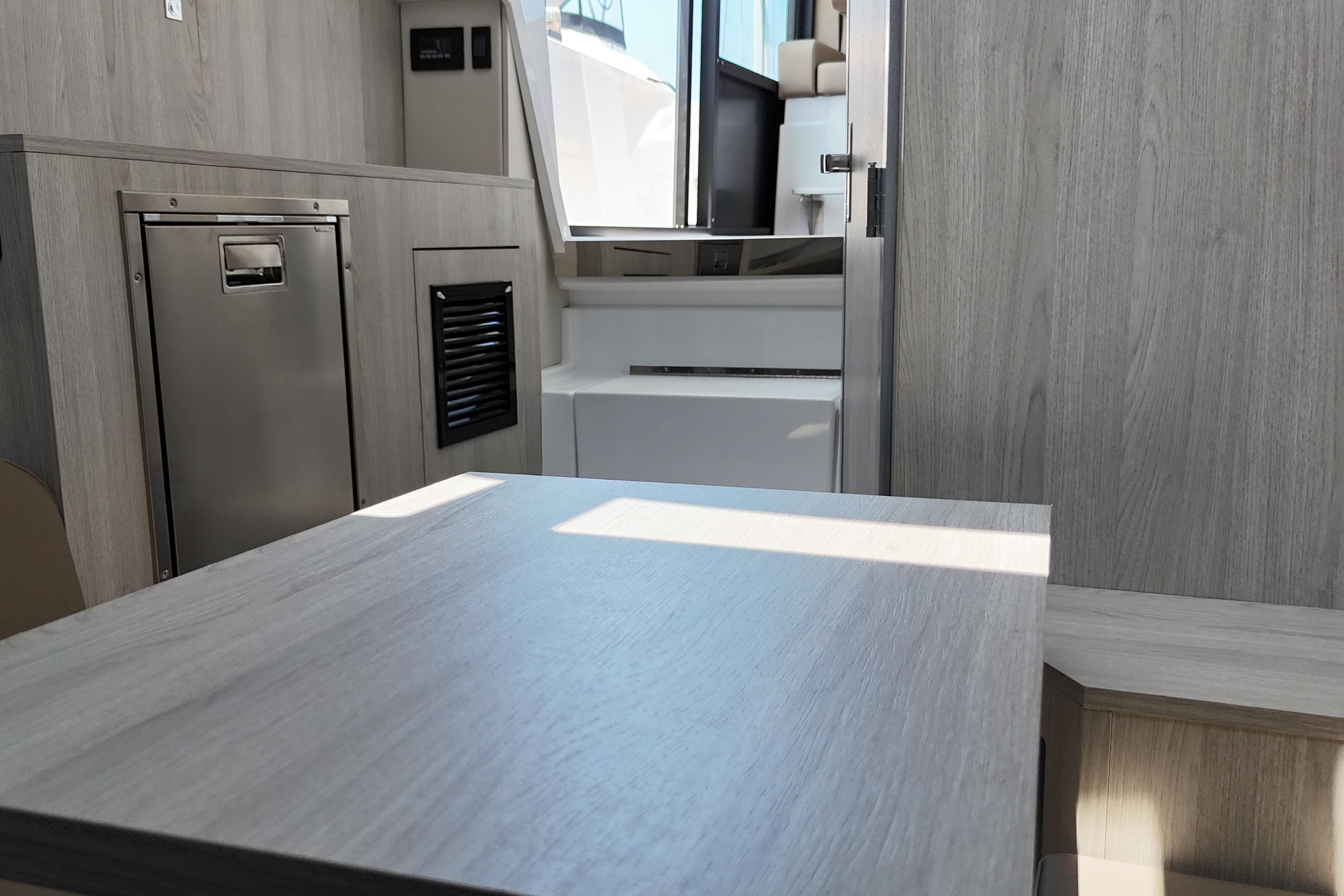Interior of 2026 Cruisers Yachts 38 VTR, featuring modern wood finishes and compact design.